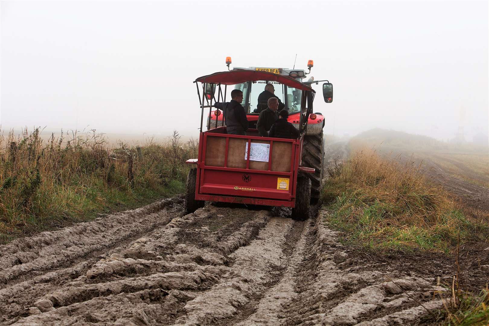 The tractor and trailer transport which toured the fields was the only way for spectators to avoid the mud, although the fog meant their view of the competitors was limited. Photo: Robert MacDonald/Northern Studios