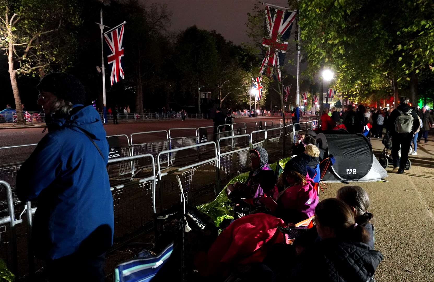 Members of the public secure their positions on The Mall in London, ahead of the Queen’s funeral (David Davies/PA)