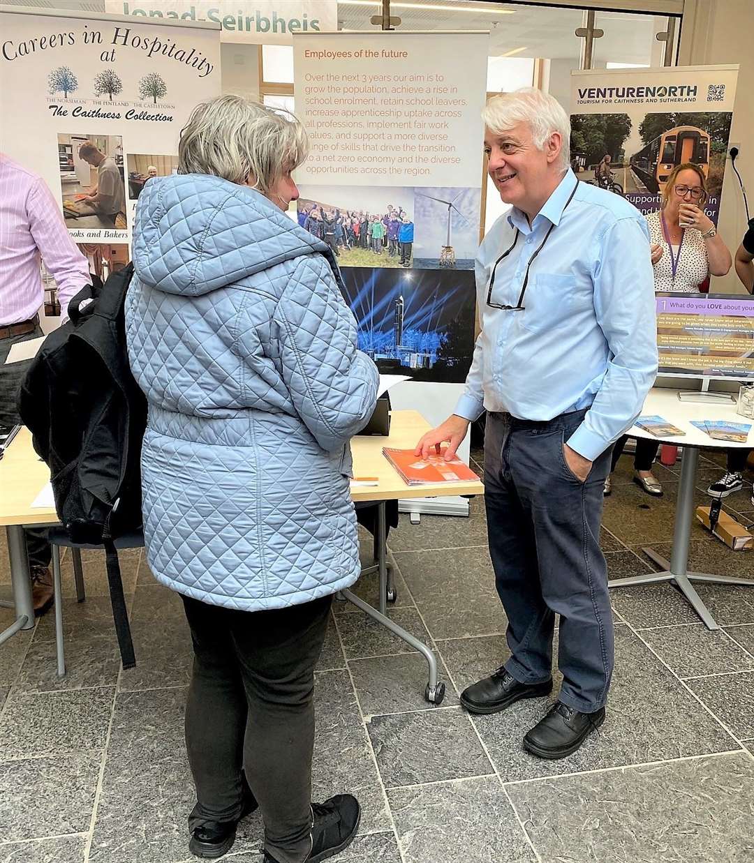 Peter Faccenda from Focus North speaking with a member of the public at the event on July 25.