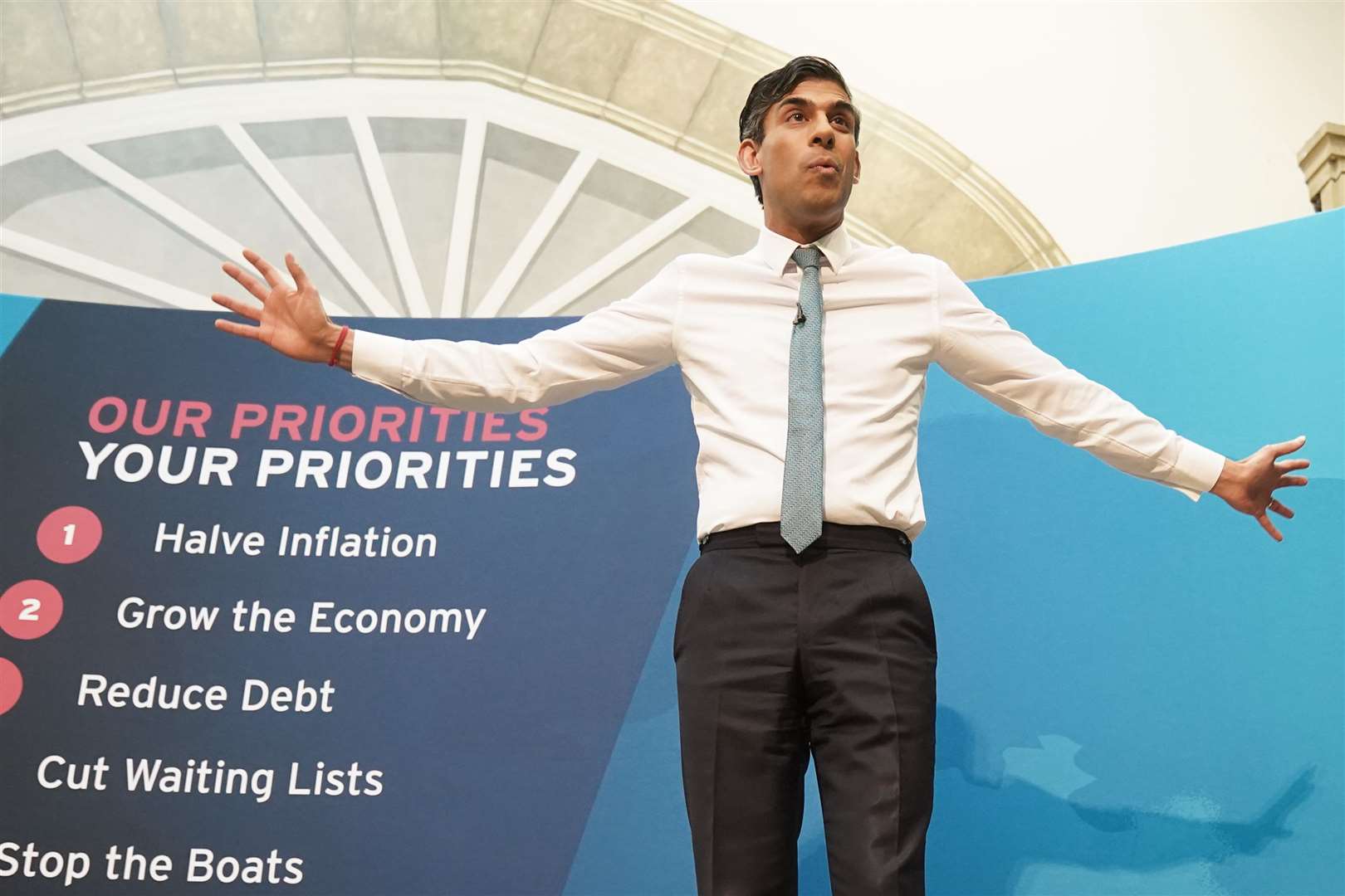 Rishi Sunak’s priorities have consistently appeared behind him as he travels the country (PA)