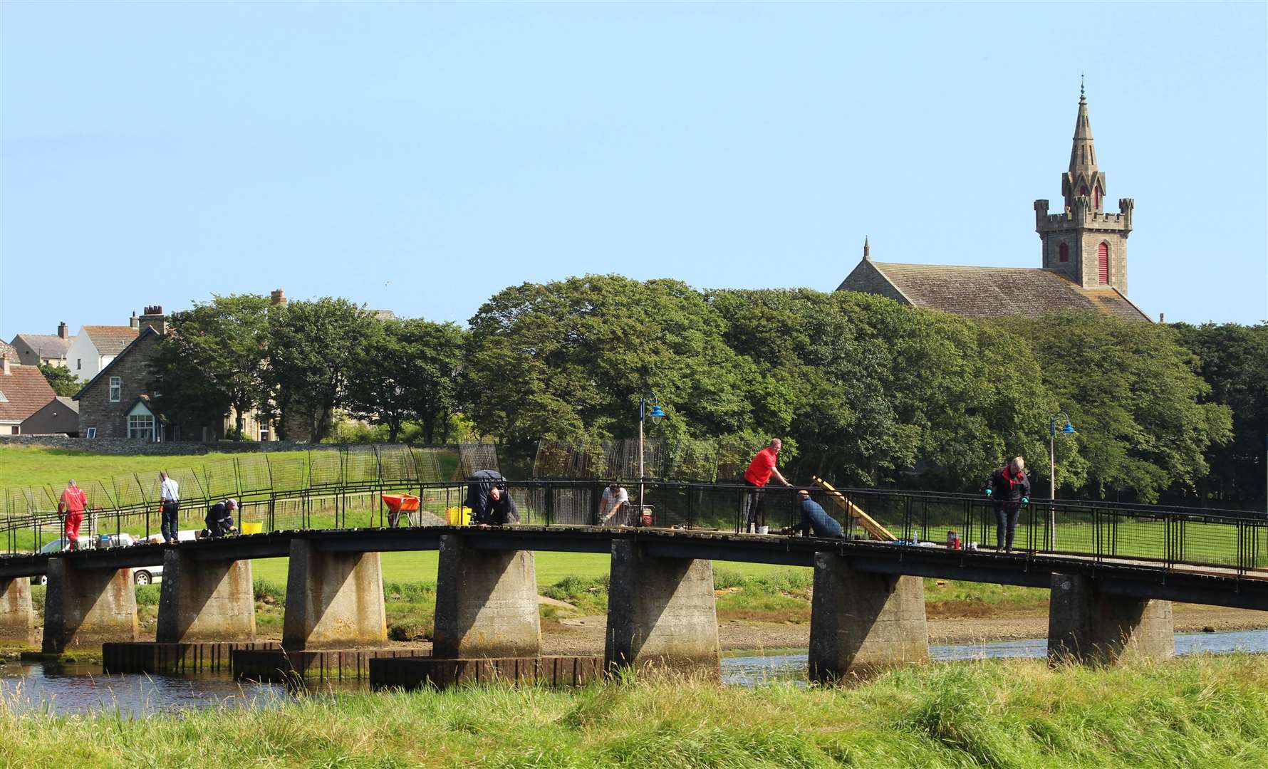 Some of the Wick volunteers pressing on with their many tasks to get the bridge project completed last weekend. Picture: Alan Hendry