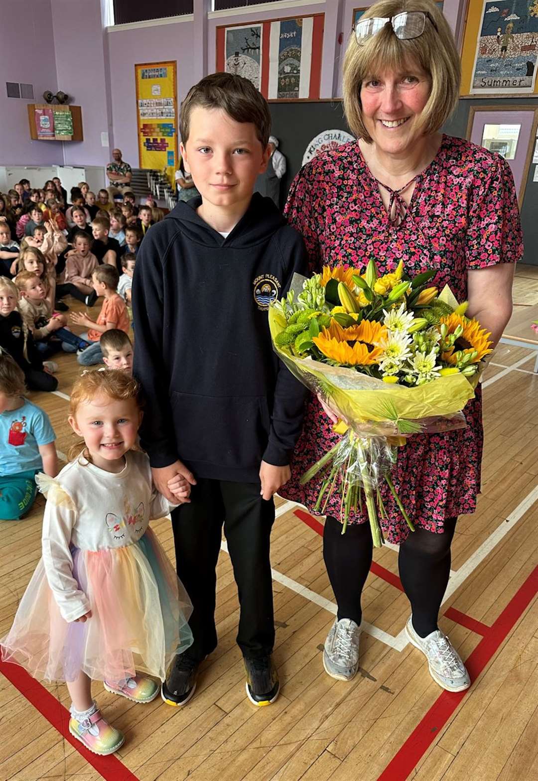 Depute head teacher Christine Firth with the school's oldest and youngest pupils at the end of term, P7 leaver Ryan Manson and nursery pupil Amber Morris.