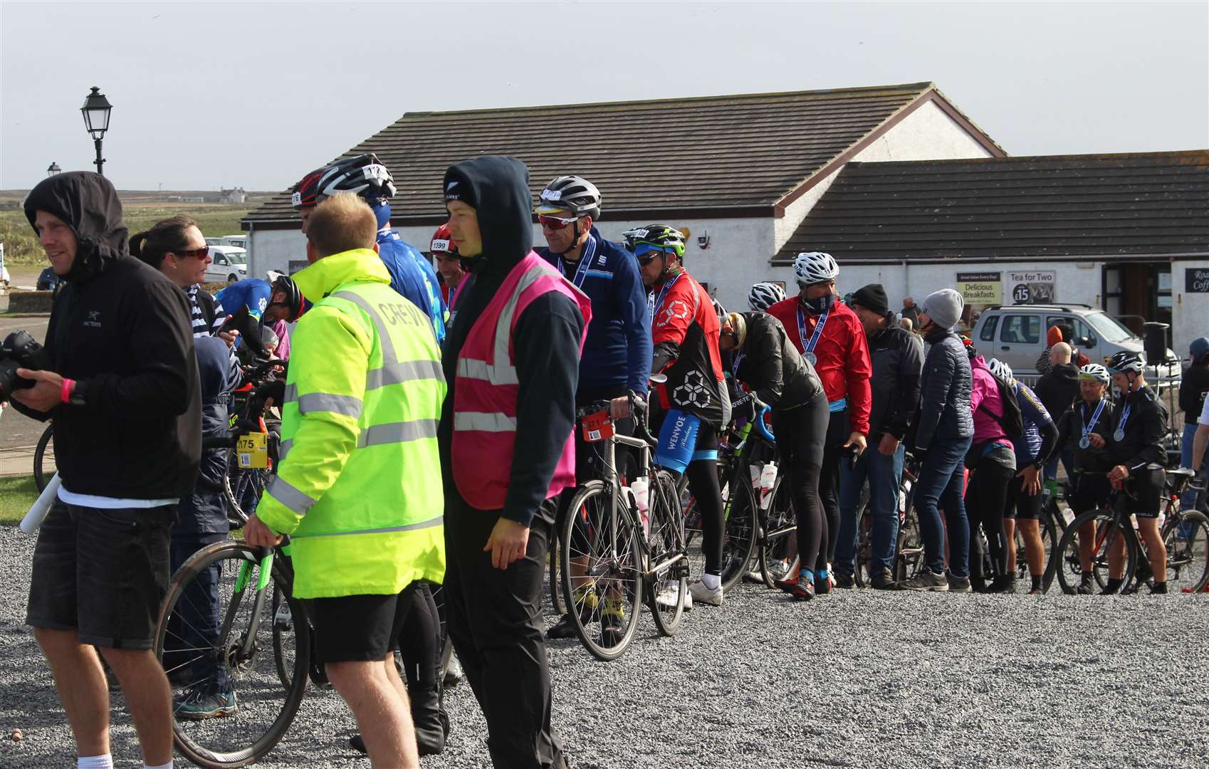 Cyclists from the Ride Across Britain queuing up to have their photos taken at the John O'Groats signpost on Sunday. Picture: Alan Hendry