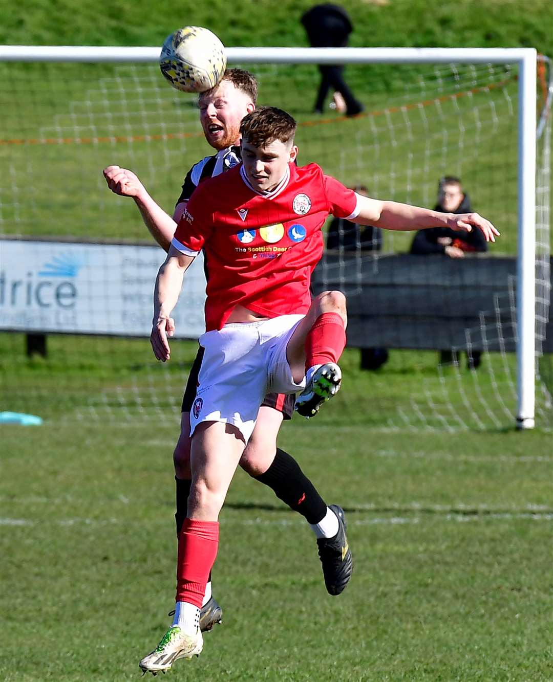 Wick Academy's Rob McLean wins an aerial battle with Lewis Martin of Brechin City. Picture: Mel Roger