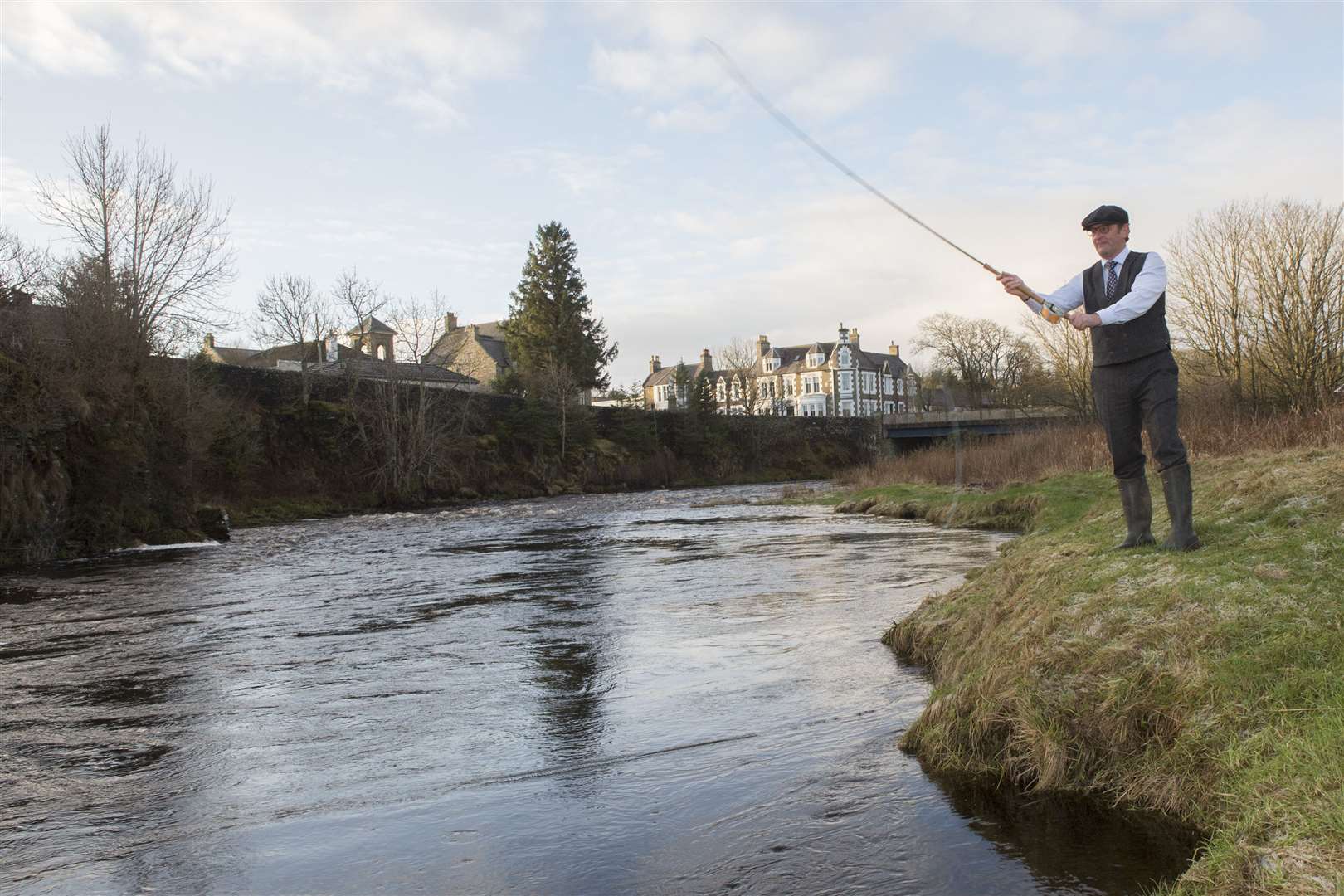 Richard Medley from Thirsk, North Yorkshire, makes the first cast to officially open the 2022 salmon season on the River Thurso. Picture: Robert MacDonald / Northern Studios