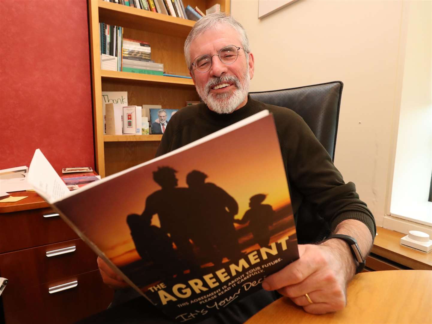Former Sinn Fein leader Gerry Adams with the Good Friday peace agreement (Niall Carson/PA)