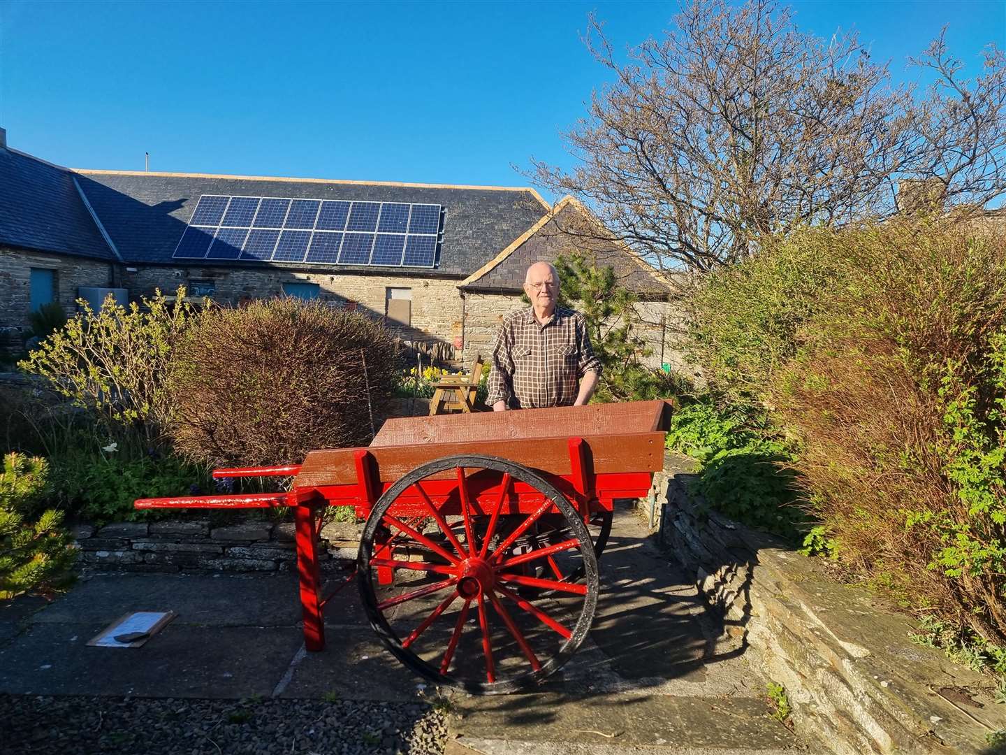 John Calder with the restored hand cart at the Castlehill Heritage Centre