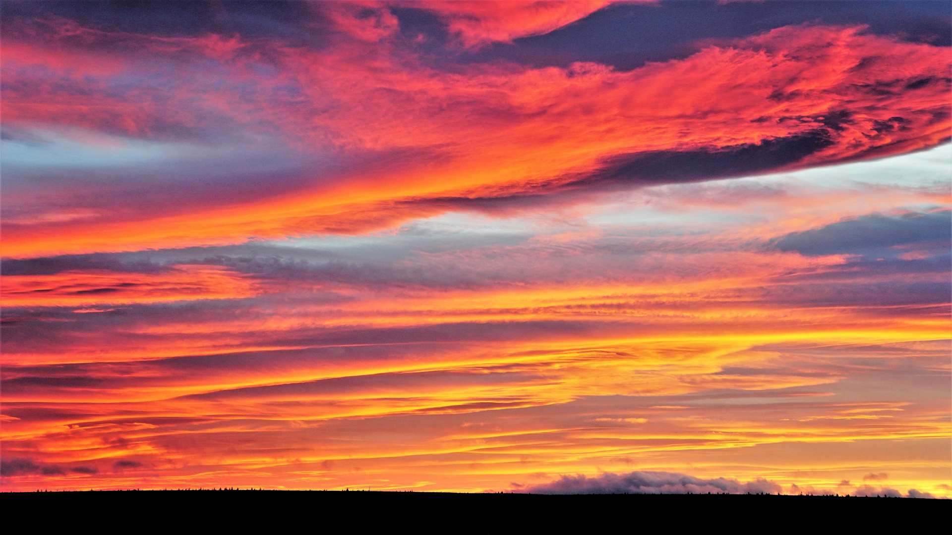 The sky over Caithness appeared slashed with an array of fiery colour shades just before the sun finally disappeared over the horizon. Picture: DGS