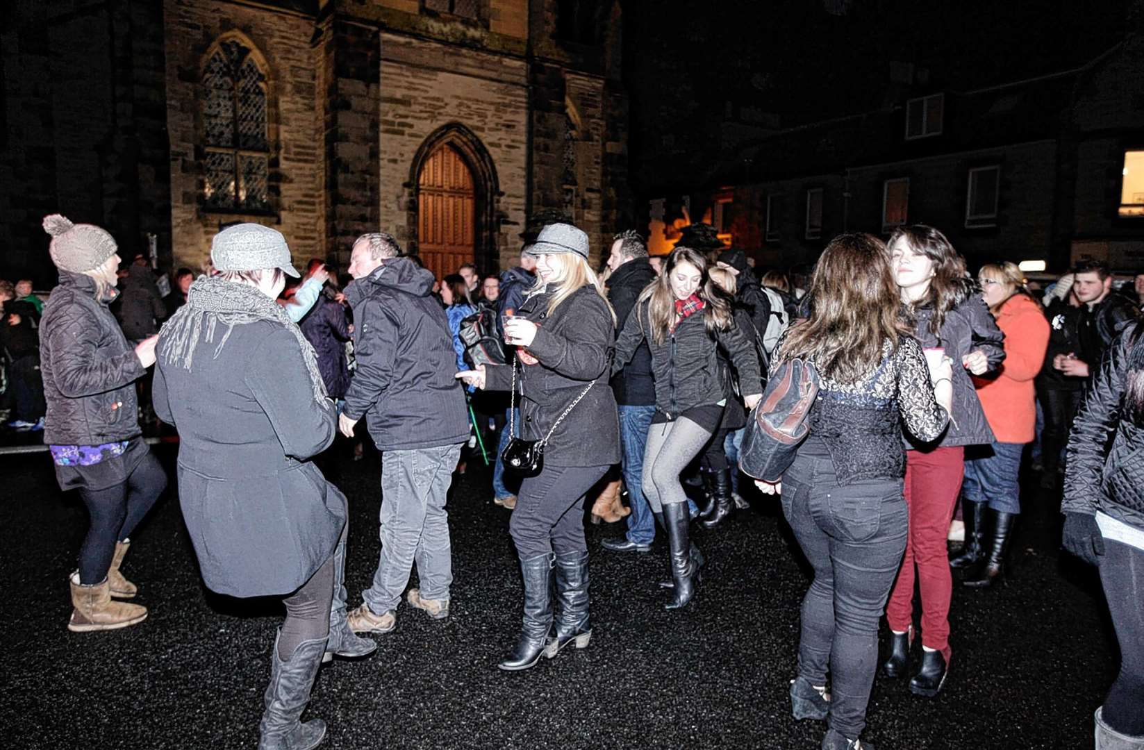 Dancing in the street on Hogmanay 10 years ago as revellers prepare to welcome in 2013 at Thurso's street party. Picture: John Baikie