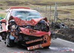The car and the burnt-out remains of the motorcycle at the scene of the accident west of Reay. Photo: Robert MacDonald.