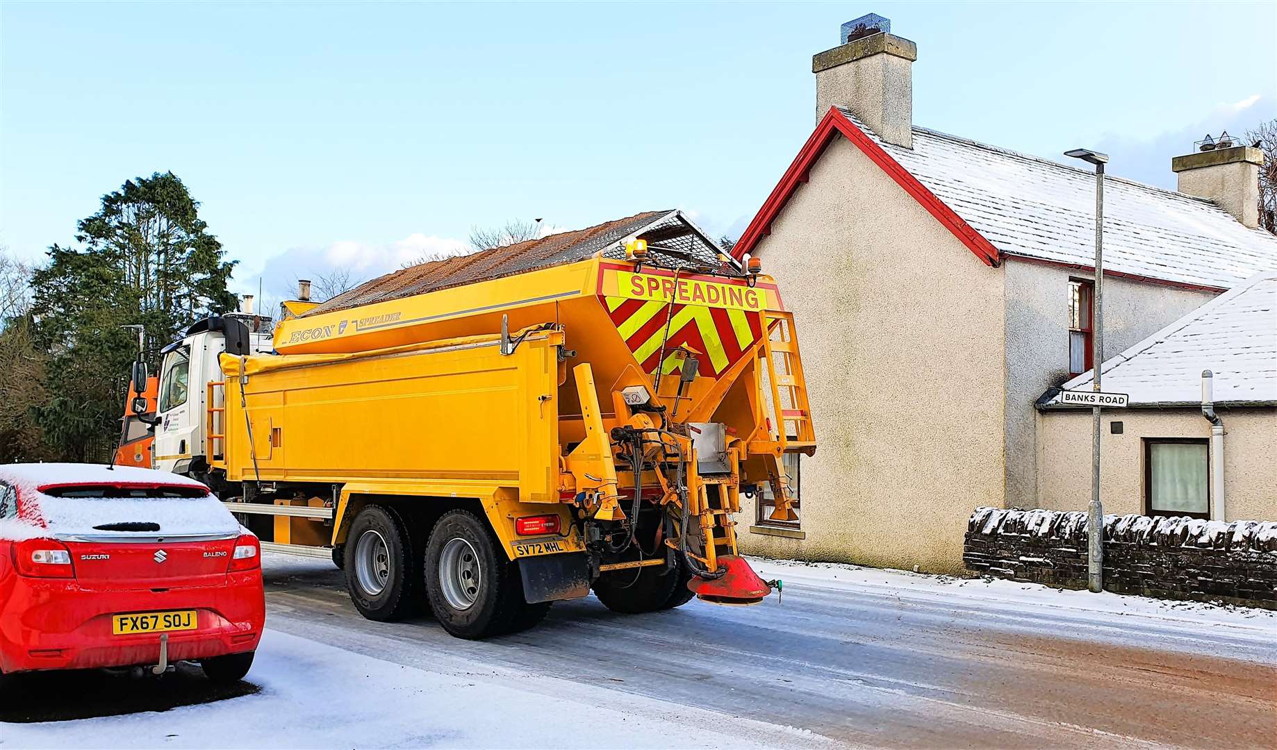 Gritter heading through Watten. The council urges drivers to take extra care during the current wintry conditions. Picture: DGS