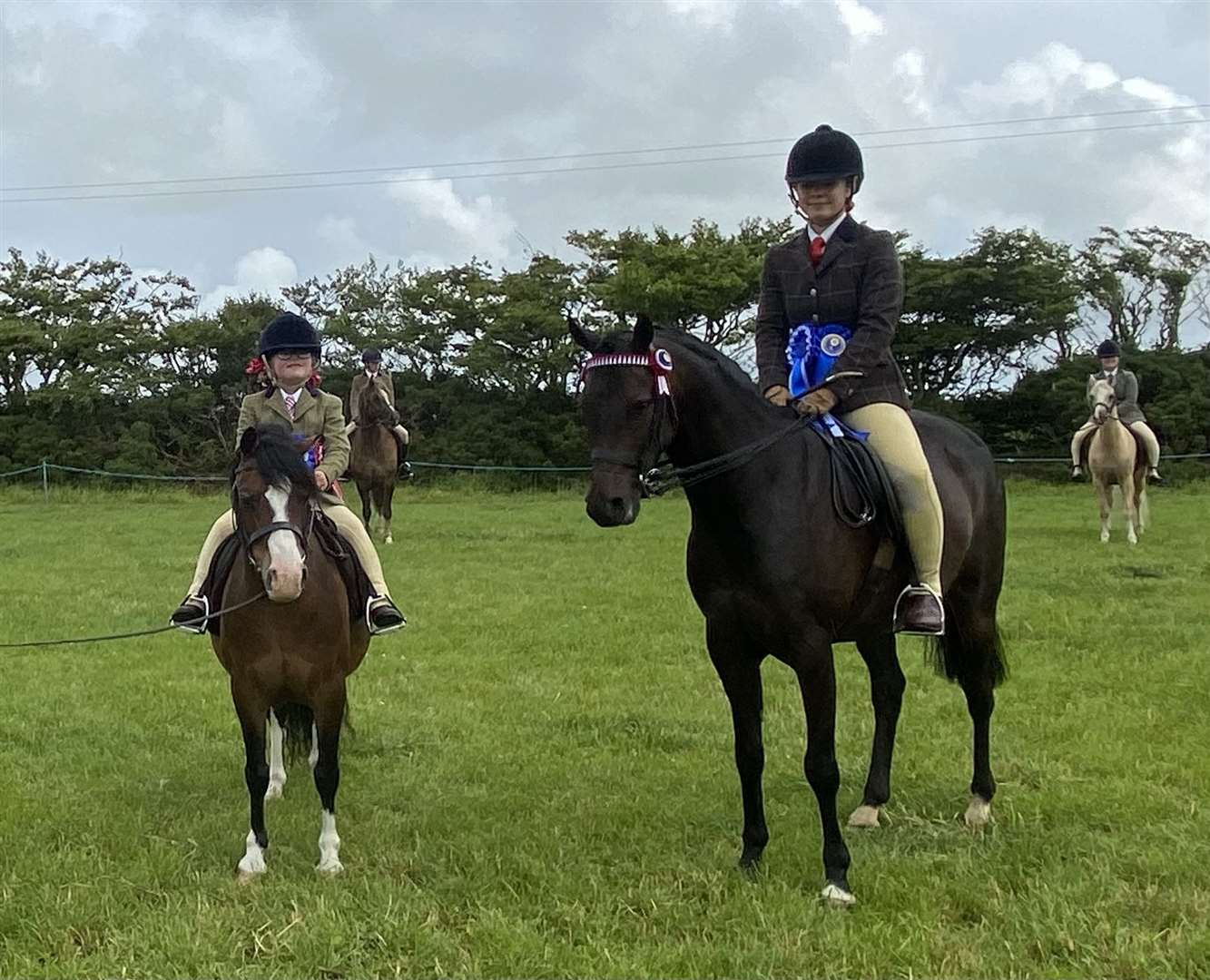 Lois Manson with ridden pony champion Bronllys Another Cherry and reserve Leoni Kennedy with Shanrye Finley.