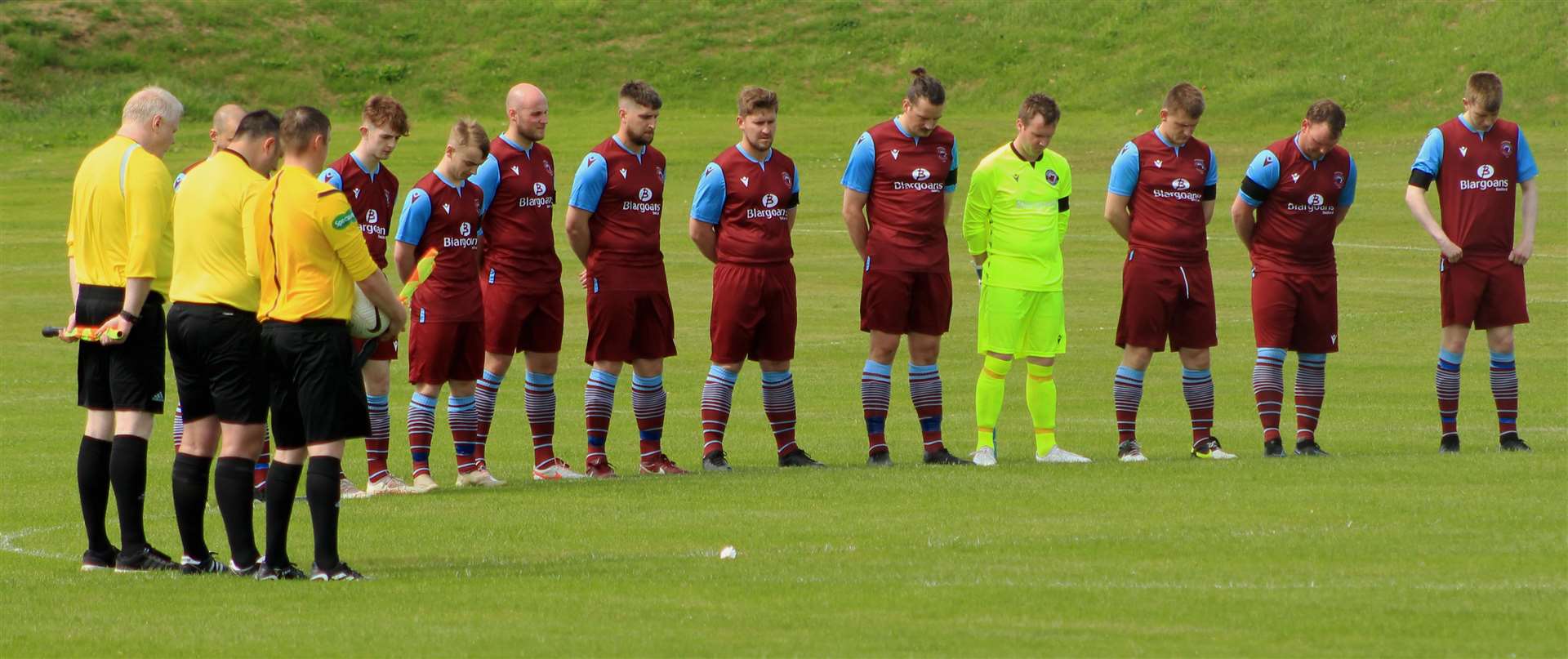 Pentland United players and match officials observing a minute's silence in memory of Liam Mackay before their Highland Amateur Cup match against Lairg Rovers in Castletown.