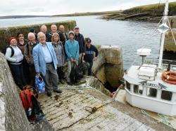 Boat skipper William Simpson (far right) along with one of the groups which crossed the Pentland Firth to Stroma last weekend