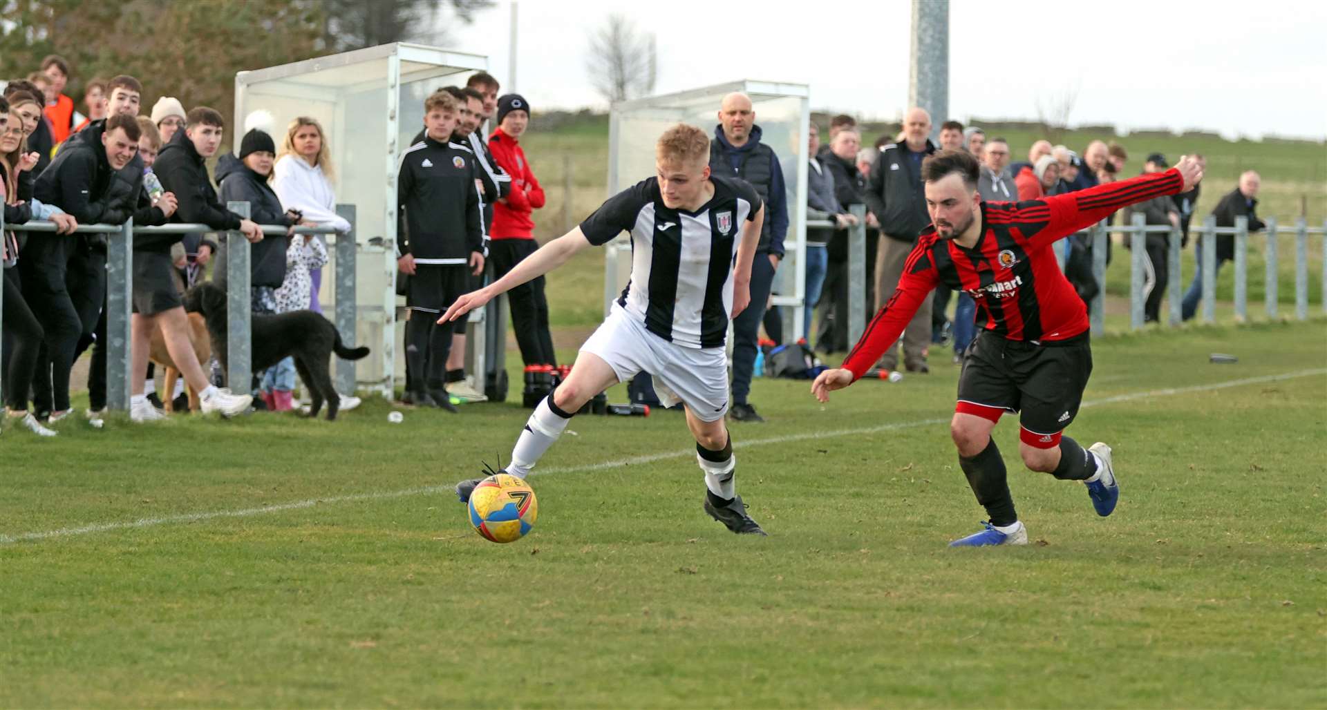 Kian Mackay tries to get past Halkirk defender Ryan Forbes. Picture: James Gunn