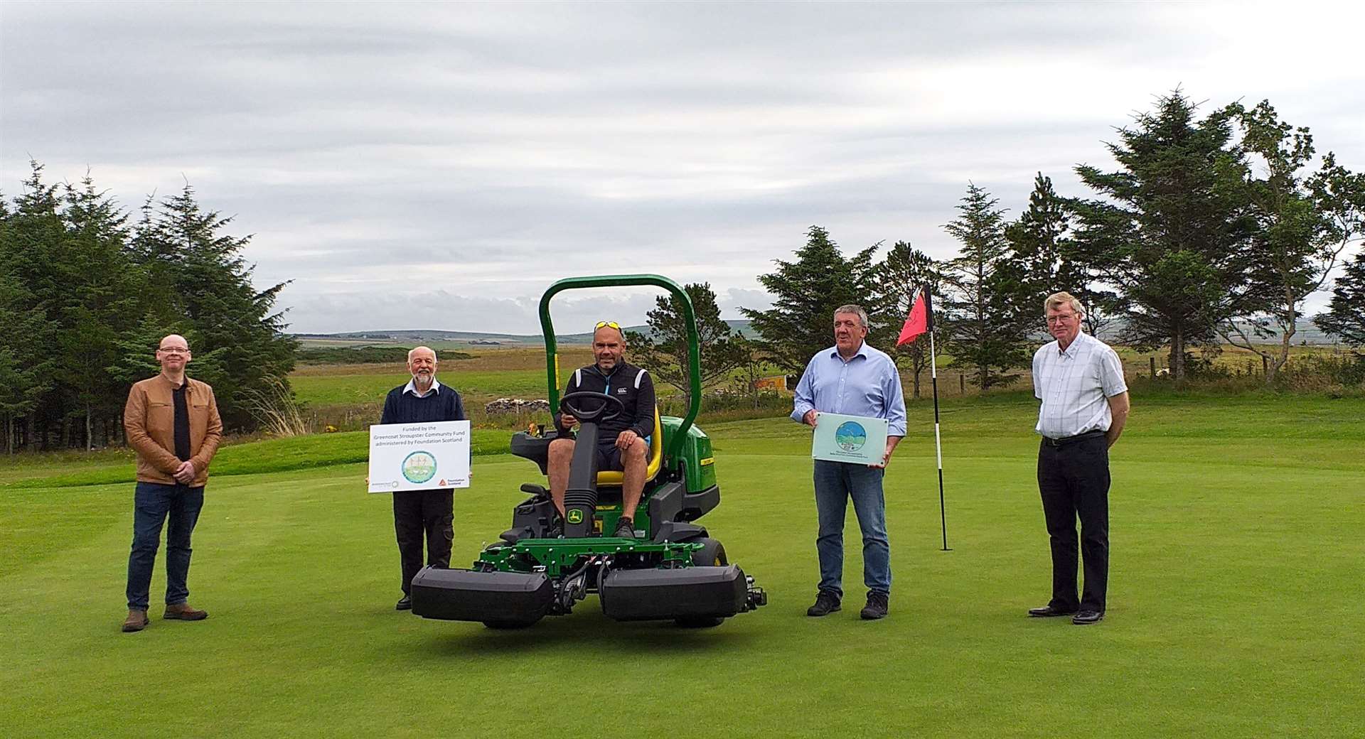 From left: David Shearer of Caithness and North Sutherland Fund; Alan Simmonite, Thurso Golf Club greens convener (holding the Stroupster Community Fund board); Frazer Sparling, Thurso's head greenkeeper; Paul Budden and Peter MacDonald of Baillie Wind Farm Community Benefit Fund.