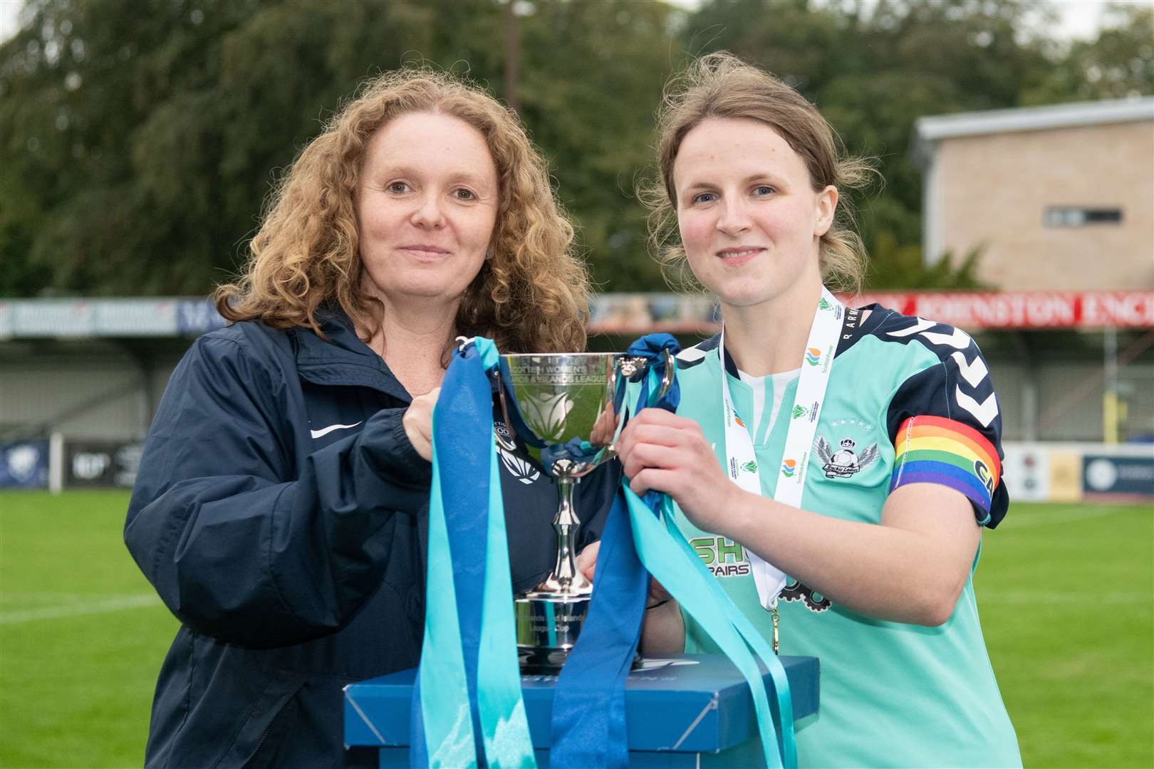 Buckie captain Rebecca McMillan receives the cup from SWF chairperson Vivienne MacLaren. Picture: Daniel Forsyth