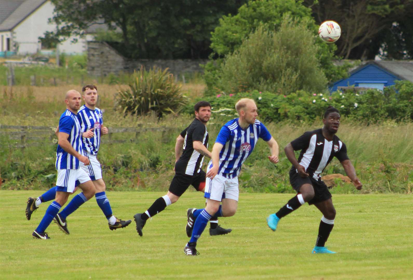 Action from Lybster's 1-0 win against Swifts in the first round of the David Allan Shield.