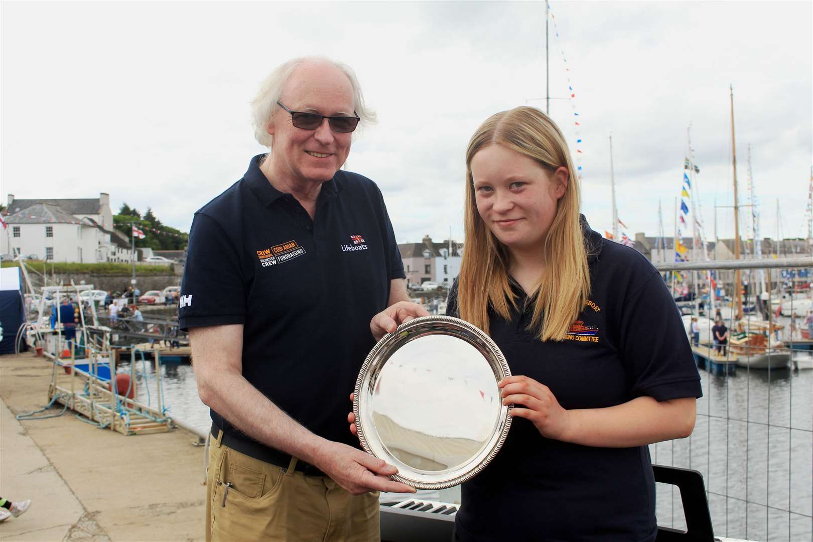 Murray Lamont, chairman of the Wick lifeboat management committee, presenting the young helper of the year award to Camilla Elder.
