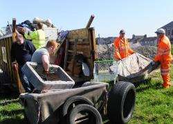 Volunteers and council workers who filled a skip with rubbish in just under 15 minutes.