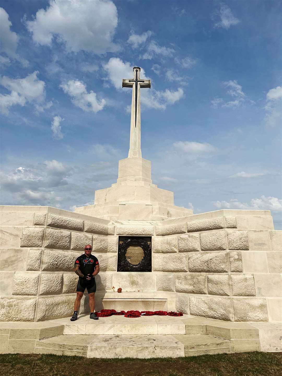 Kev at Tyne Cot cemetery. The Cross of Sacrifice cross is in memory of those whose bodies were not found.