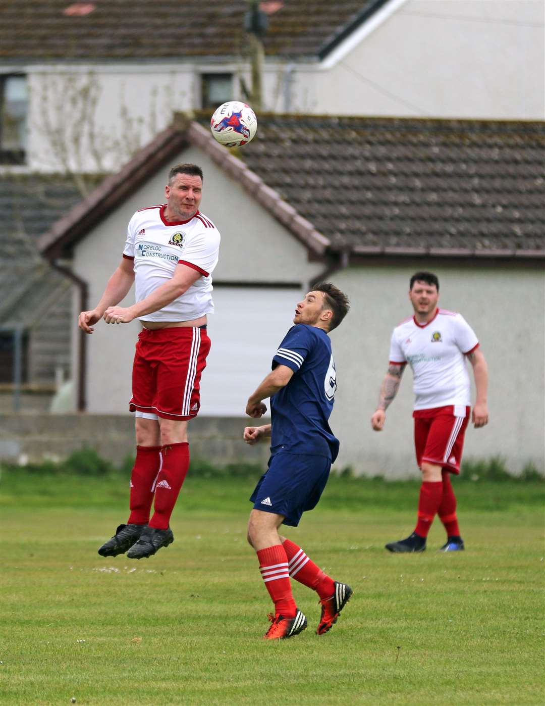 Halkirk's Michael Bremner heads clear during his side's 3-1 loss to Brora Wanderers. Picture: James Gunn