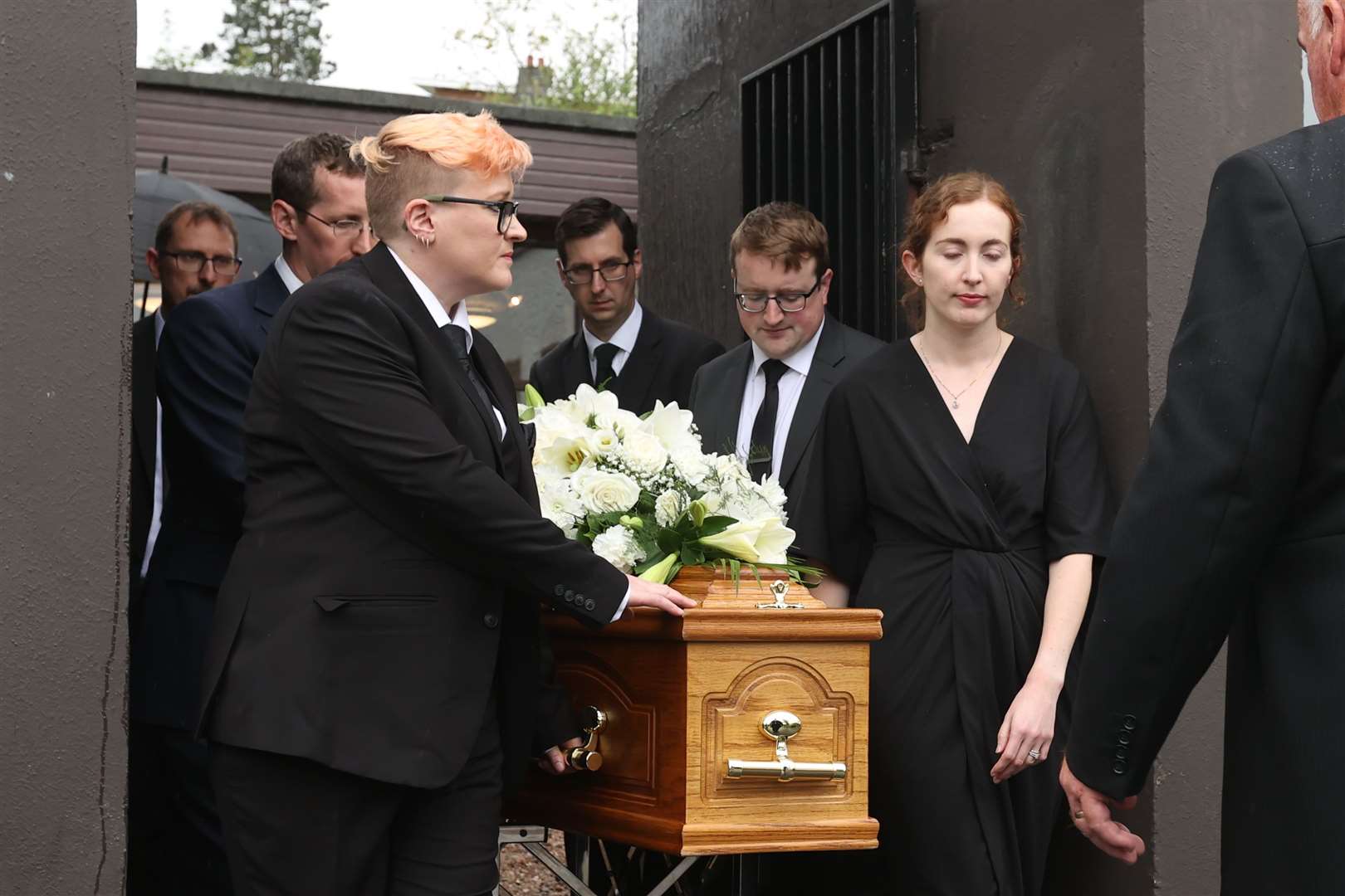 (left to right) Richard, Victoria, Nicholas and Sarah Trimble carry the coffin of their father (Liam McBurney/PA)