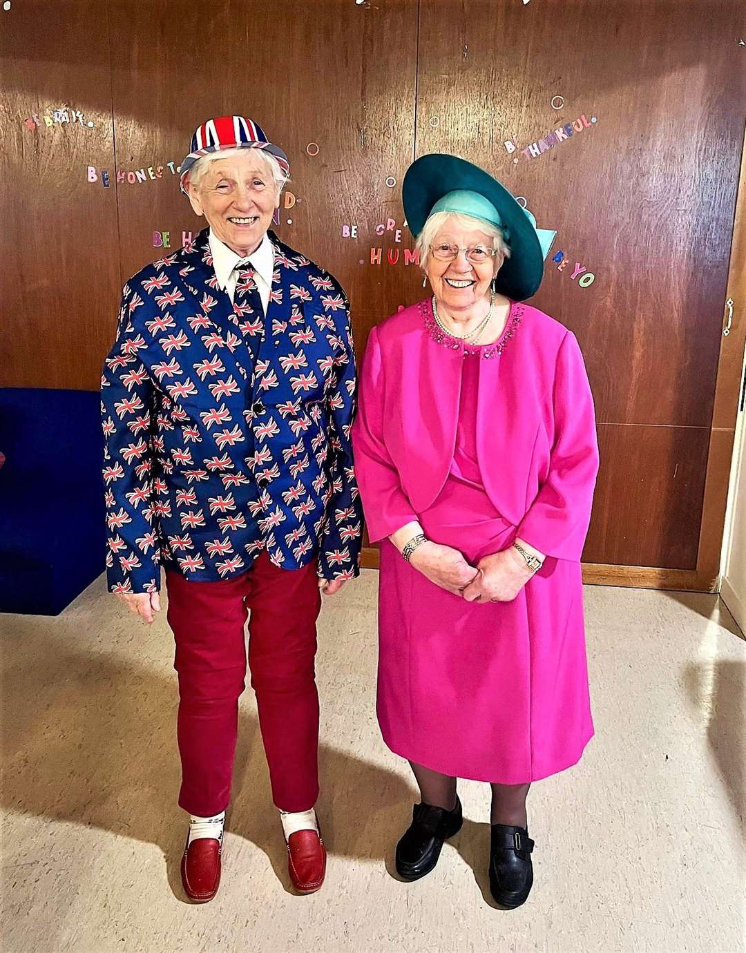 Jane Bremner, on the left, dressed as King Charles III and her sister Lily MacGregor was in a Camilla-inspired outfit for her 93rd birthday at the Monday Club party in Wick.