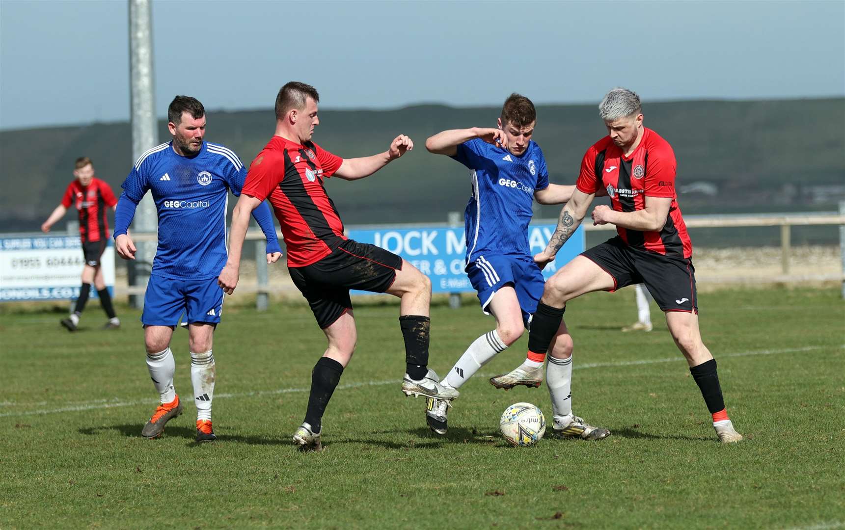 Andy Mackay and Kuba Koziol join forces to try and win back possession for Halkirk United. Picture: James Gunn
