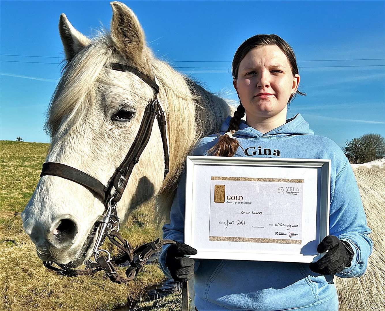 Gina with YELA gold award and Paris the horse. Gina has been invited to attend the 2023 YELA presentation.