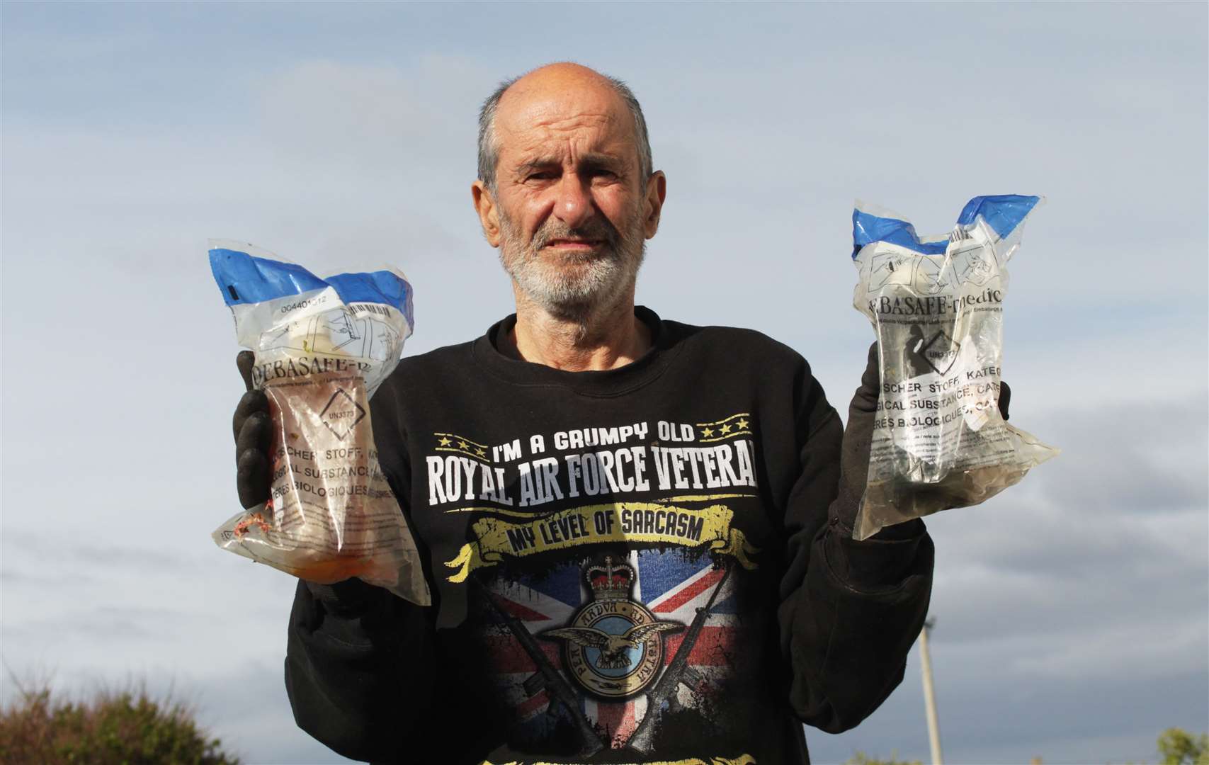 Nigel Eustace holding two of the biological specimen bags he discovered at Keiss. Picture: Alan Hendry
