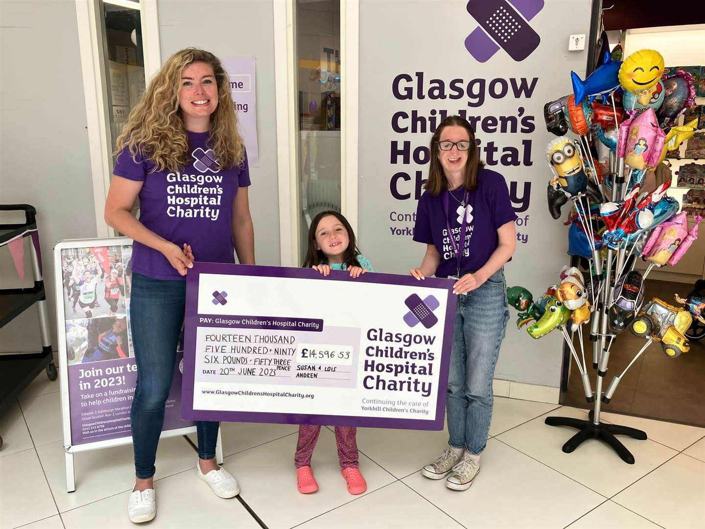 Susan Andrew and daughter Lois hand over the cheque for £14,596.53 to Lucy Ritchie of the Glasgow Children's Hospital charity during a recent visit.