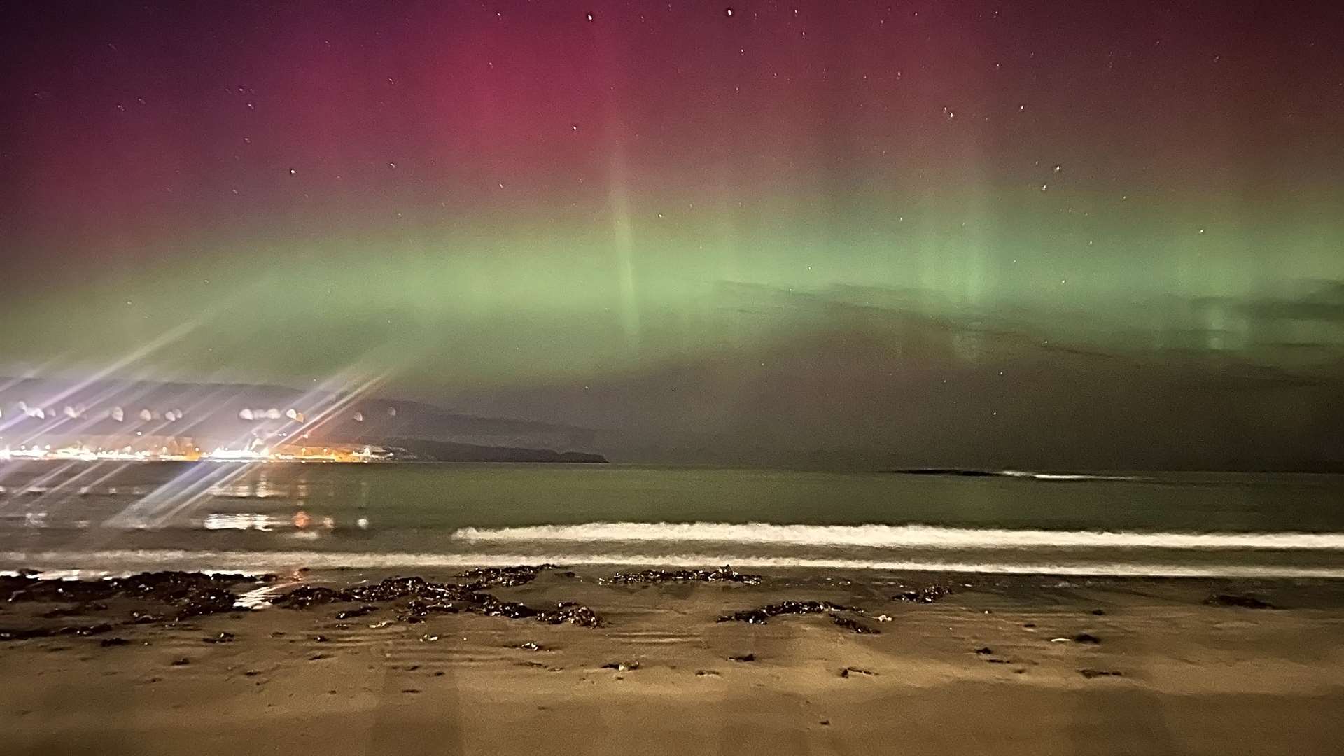 The northern lights over Thurso Bay on Saturday night while the Rotary Club fireworks display was being held. Picture: Mel Roger