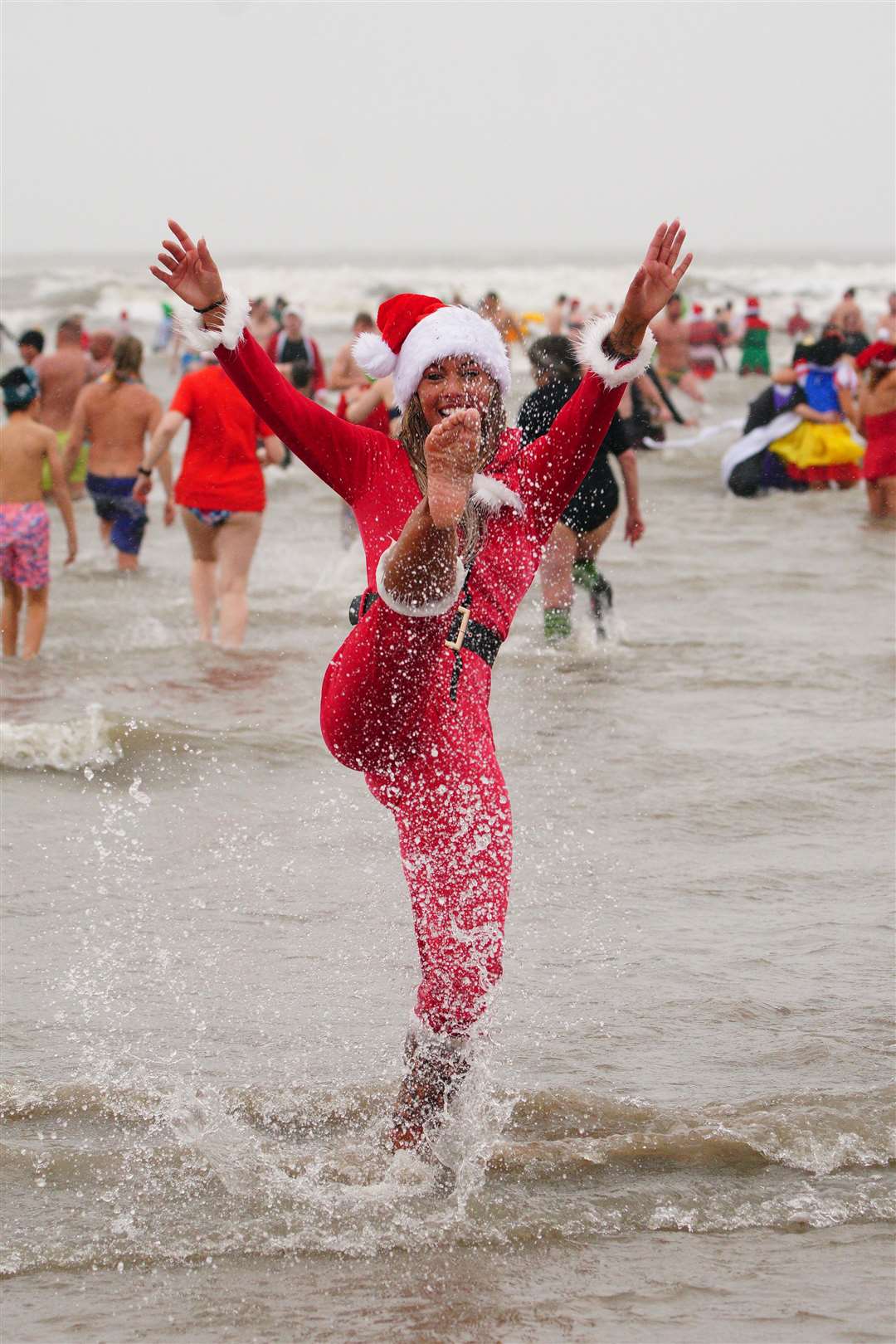 There’s no rain on this parade for swimmers in Wales Porthcawl, Wales (Ben Birchall/PA)