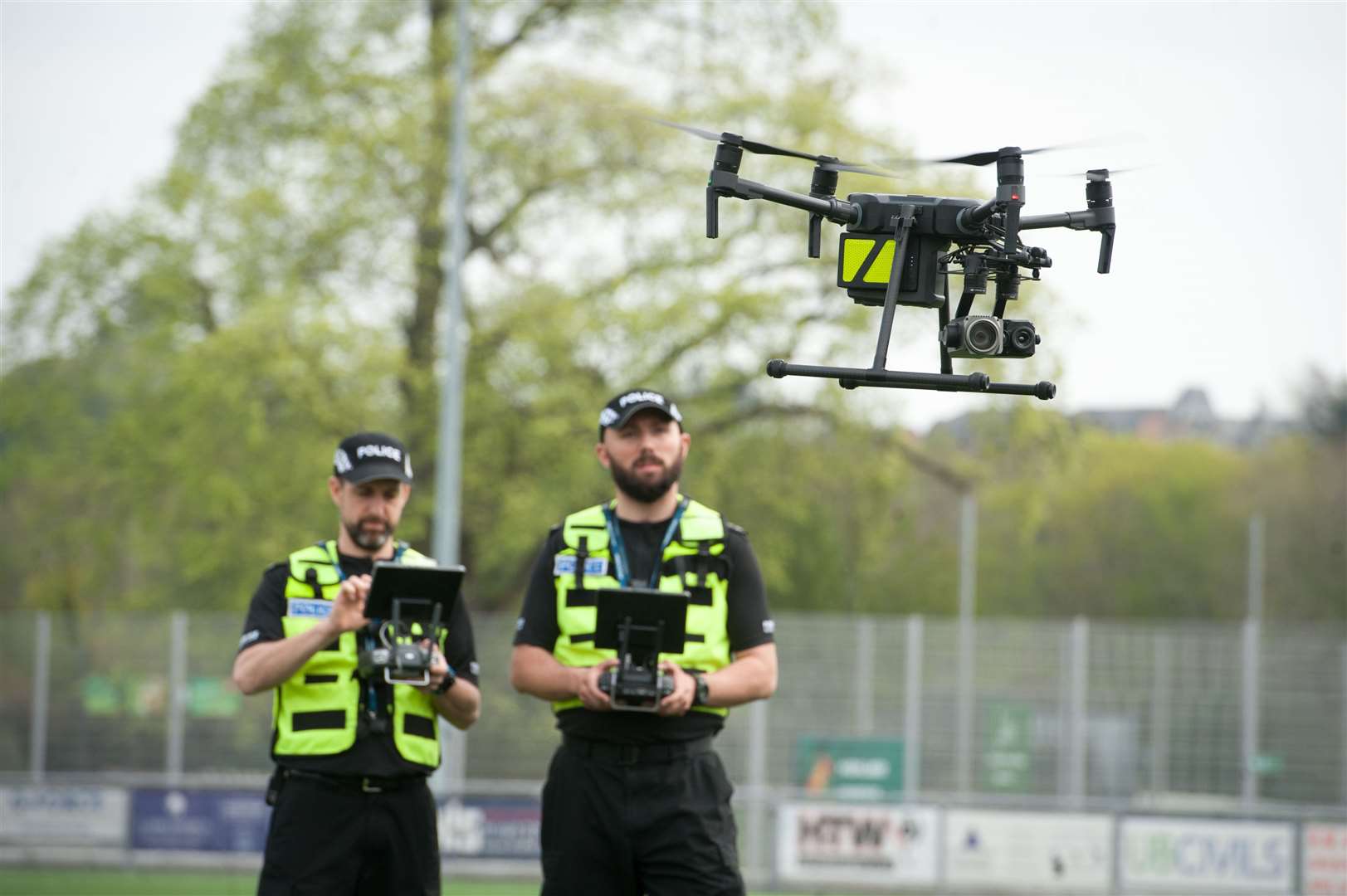 Police Scotland officers with remotely-operated drones. Picture: Callum Mackay.