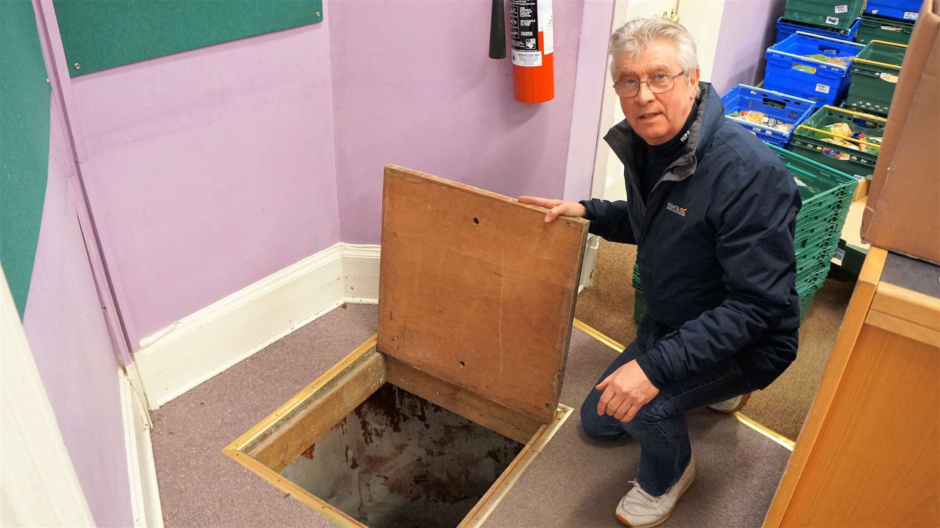 Roy Mackenzie opens the hatch to the cellar where the statues were deposited some decades ago. Picture: DGS