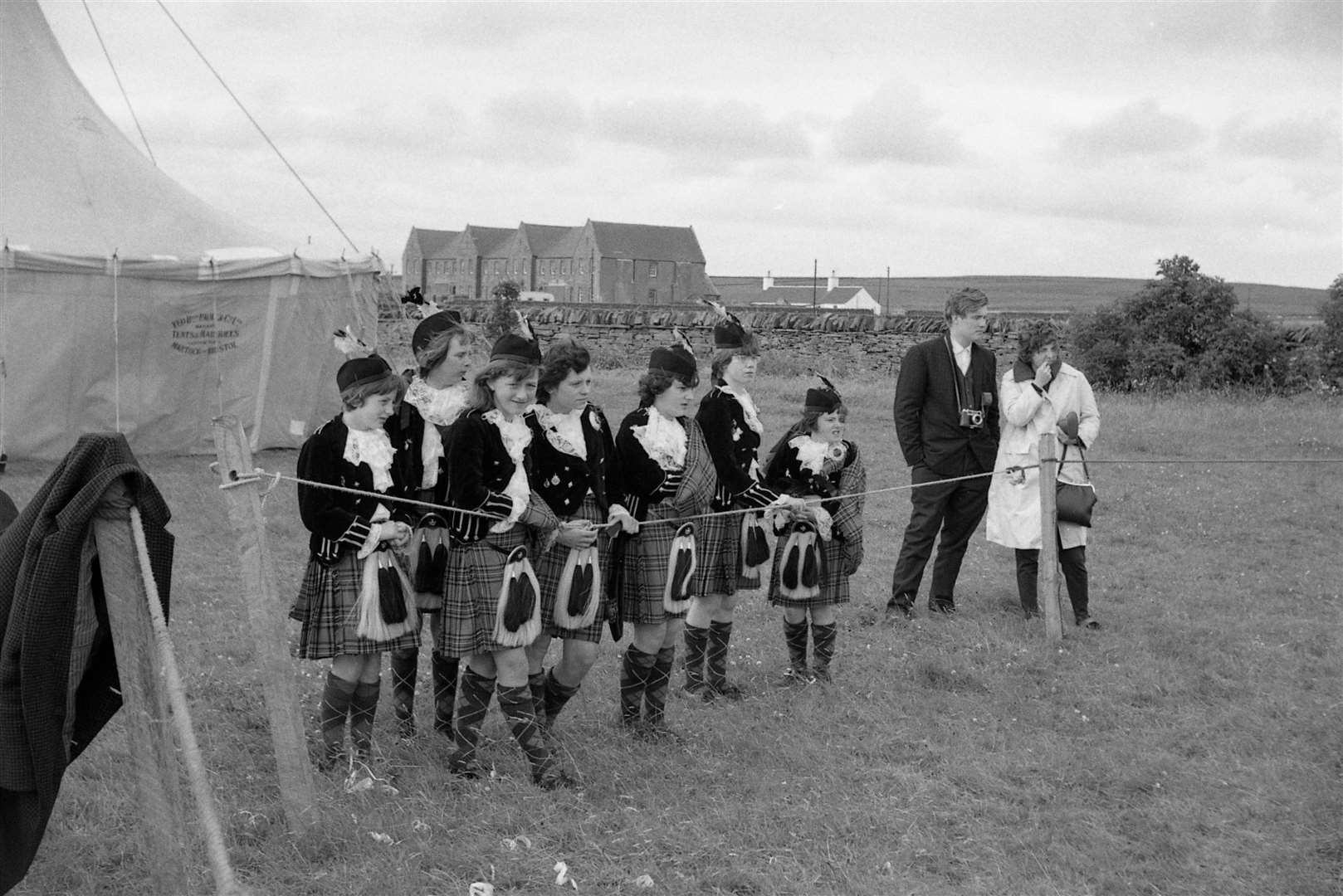 Pipers getting ready to play at the Halkirk Highland Games, with the former Thurso Combination Poorhouse in the background. Jack Selby Collection / Thurso Heritage Society