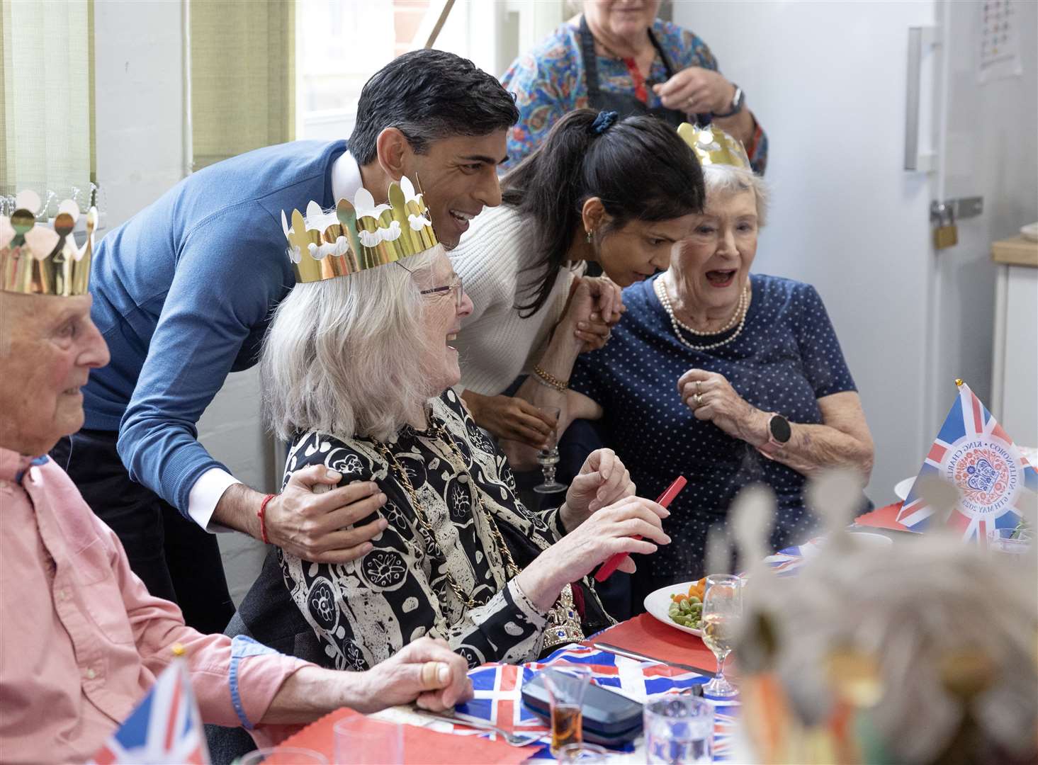 Prime Minister Rishi Sunak and his wife Akshata Murty chat to members of a community group lunch club at Mill End Community Centre in Rickmansworth as part of the Big Help Out (Geoff Pugh/Daily Telegraph/PA)