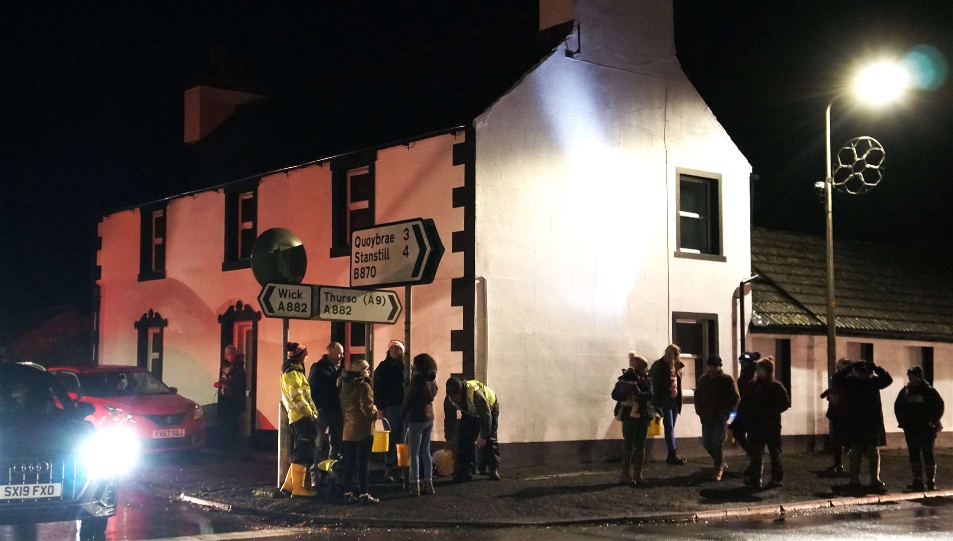 A crowd of onlookers watch from outside Thor House in Watten. Picture: DGS