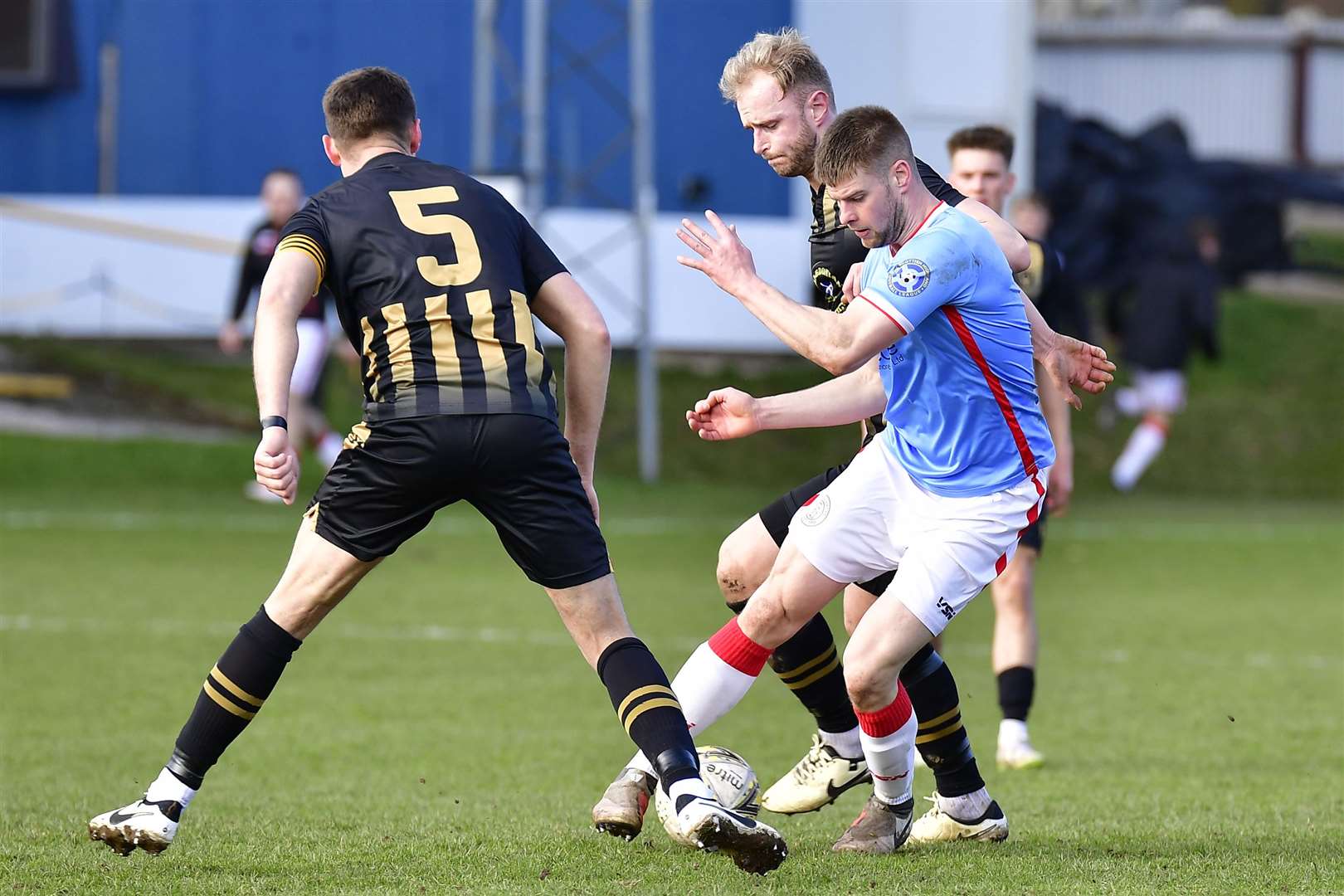 Wick Academy striker Marc Macgregor wrong-foots Huntly pair Ross Still and Michael Clark during last Saturday's match at Christie Park. Picture: Mel Roger