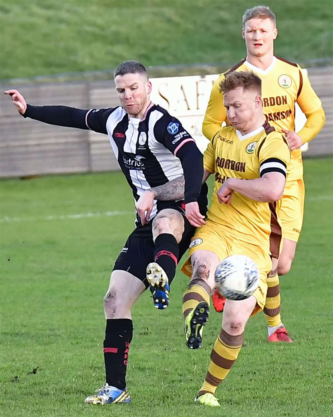 Wick Academy's Davie Allan challenges Forres' Stuart Soane (right) during last week's home defeat against the Can-Cans. Picture: Mel Roger