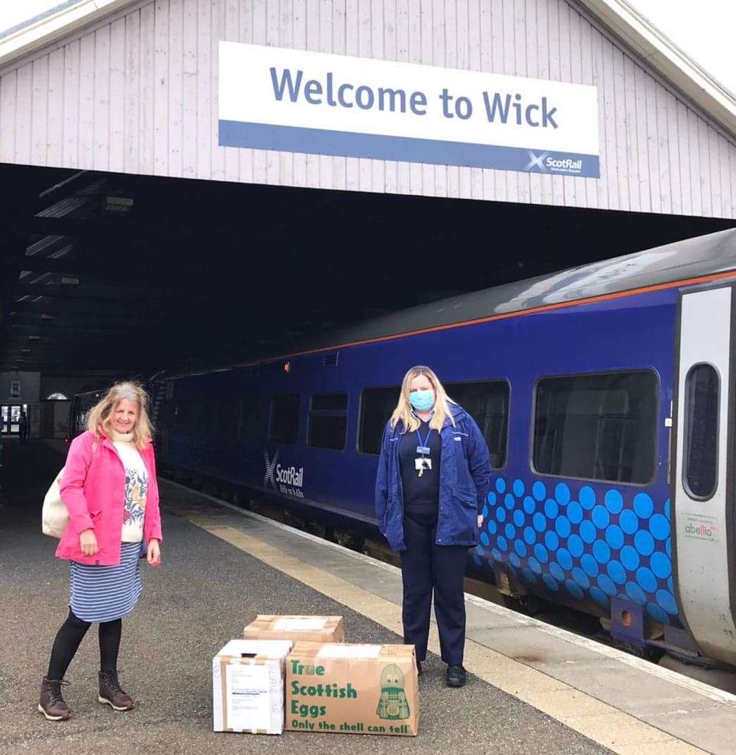Caithness resident Susan Martens collects the scrubs from conductor Martyna Lelonkiewicz at Wick station.