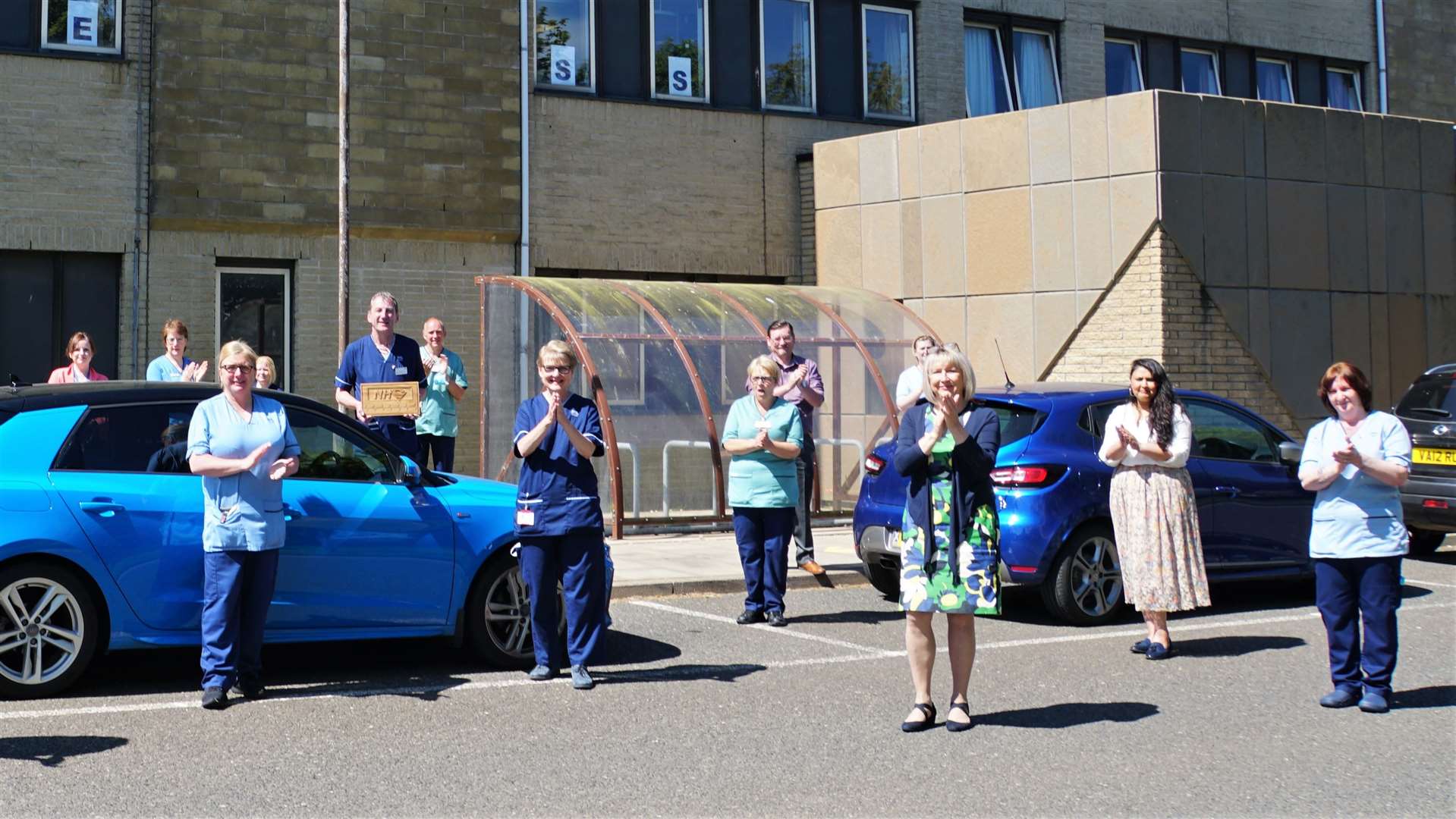 Hospital manager Pam Garbe, third from right, leads a staff clapping event last year. She said the funding 'will improve services locally'. Picture: DGS