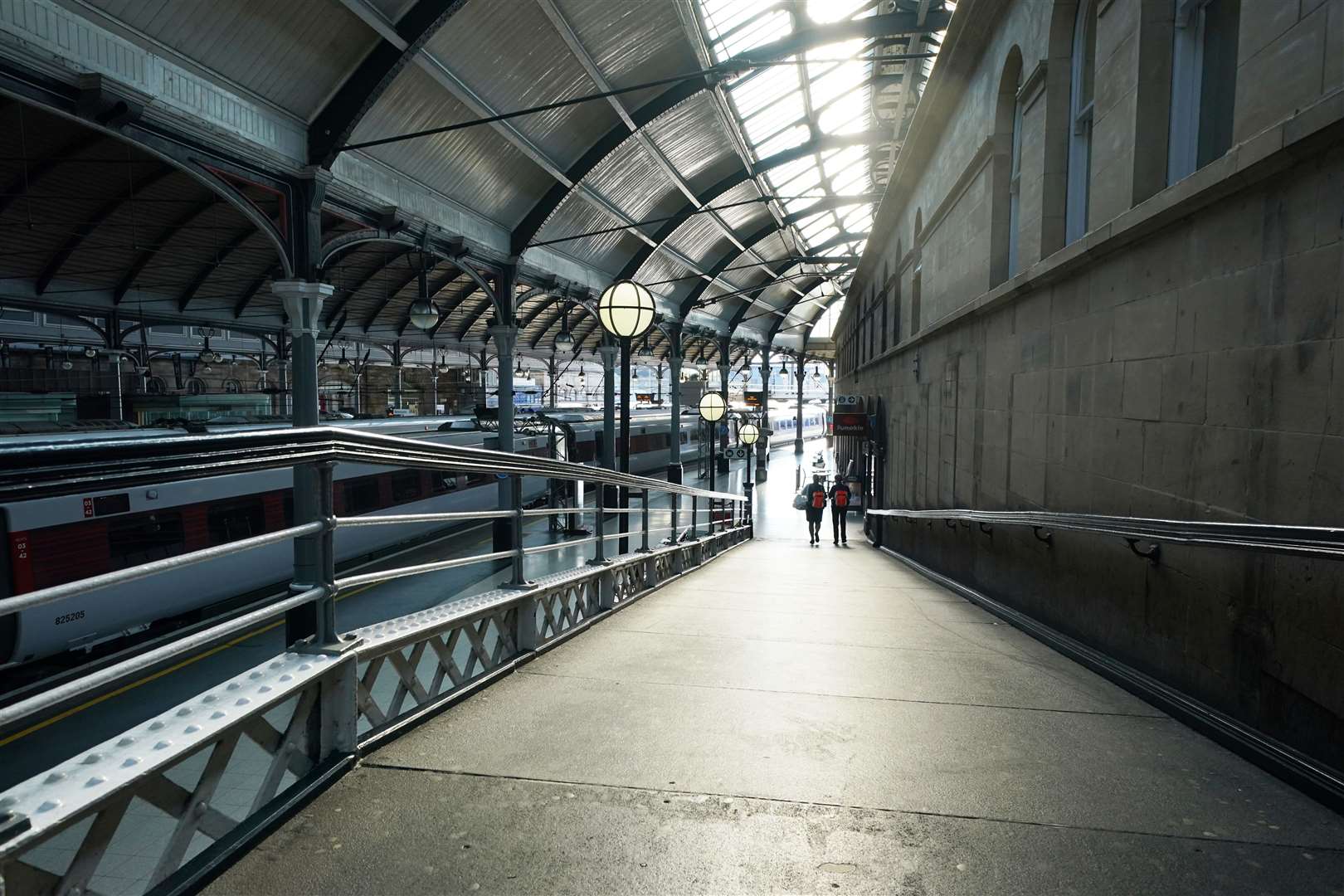 Passengers at a quiet Newcastle station (Owen Humphreys/PA)