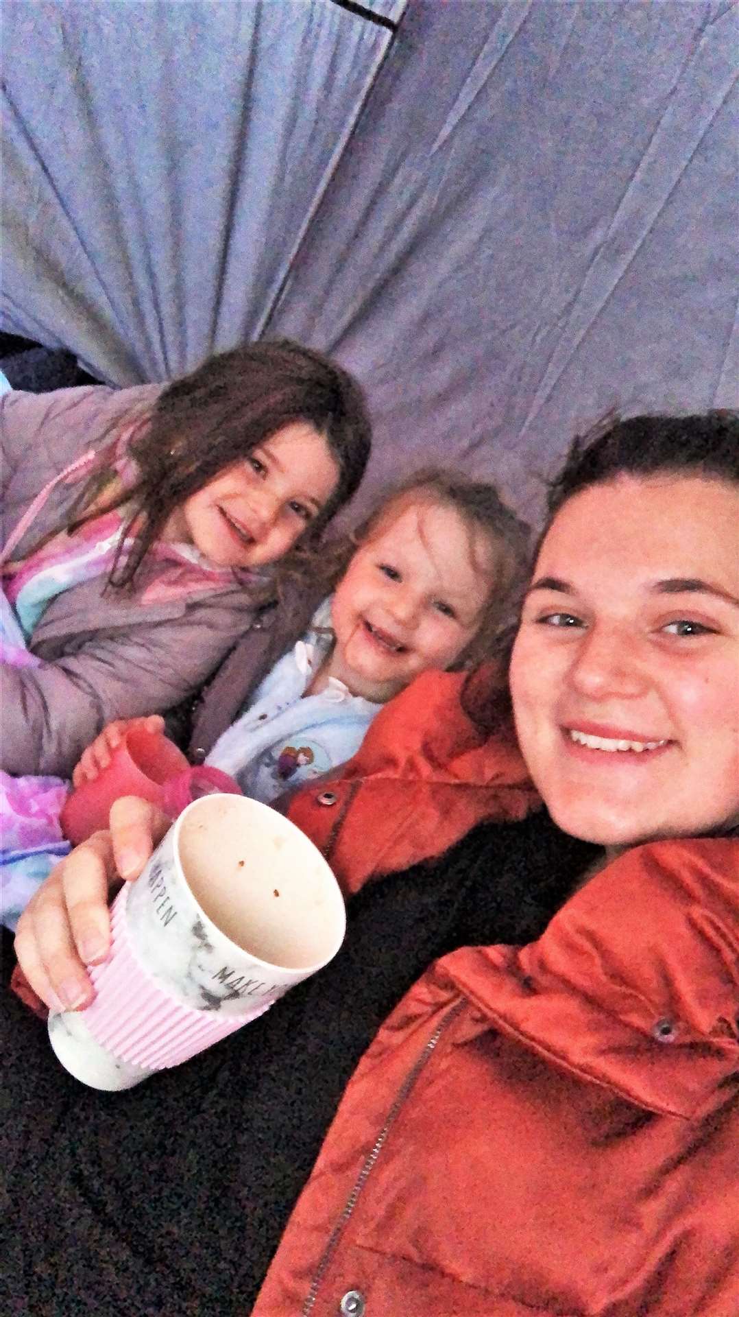 Hannah with her children Ferne and Lori in their tent at Reiss.