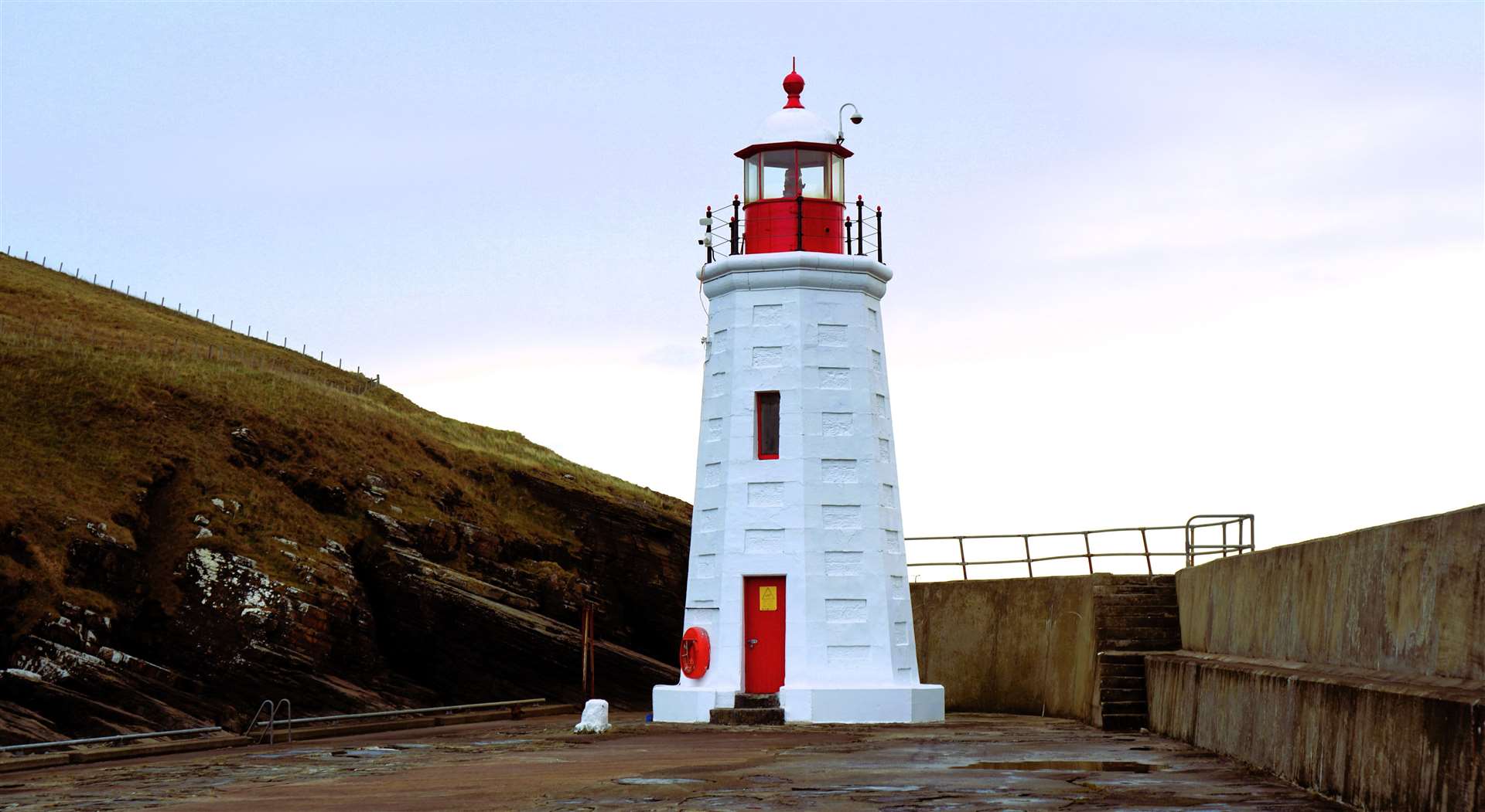 Lybster Harbour's lighthouse beams brightly after recently being repainted. Picture: DGS
