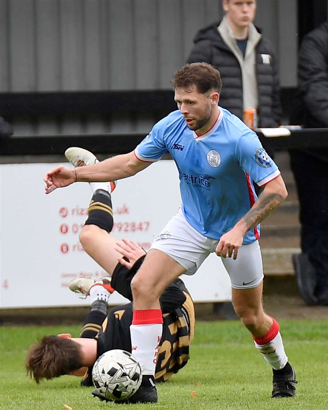 Wick Academy midfielder Jack Henry wins the ball from Huntly's Matthew Wallace. Picture: Mel Roger