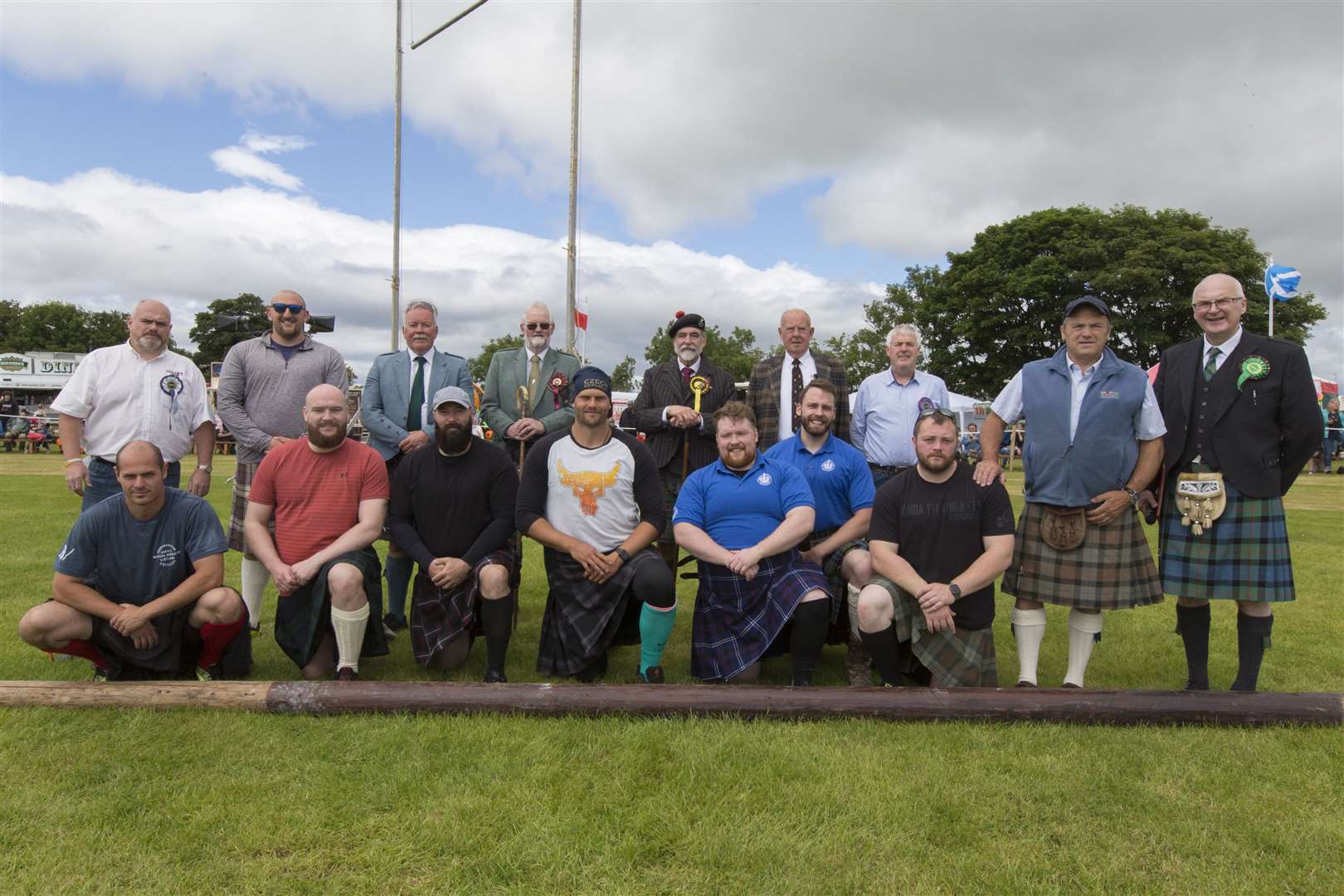 Heavy athletes and officials pose for a photograph along with games chieftain Lord Thurso (back, centre right) and president Alistair Swanson (back, fourth left). Picture: Robert MacDonald/Northern Studios