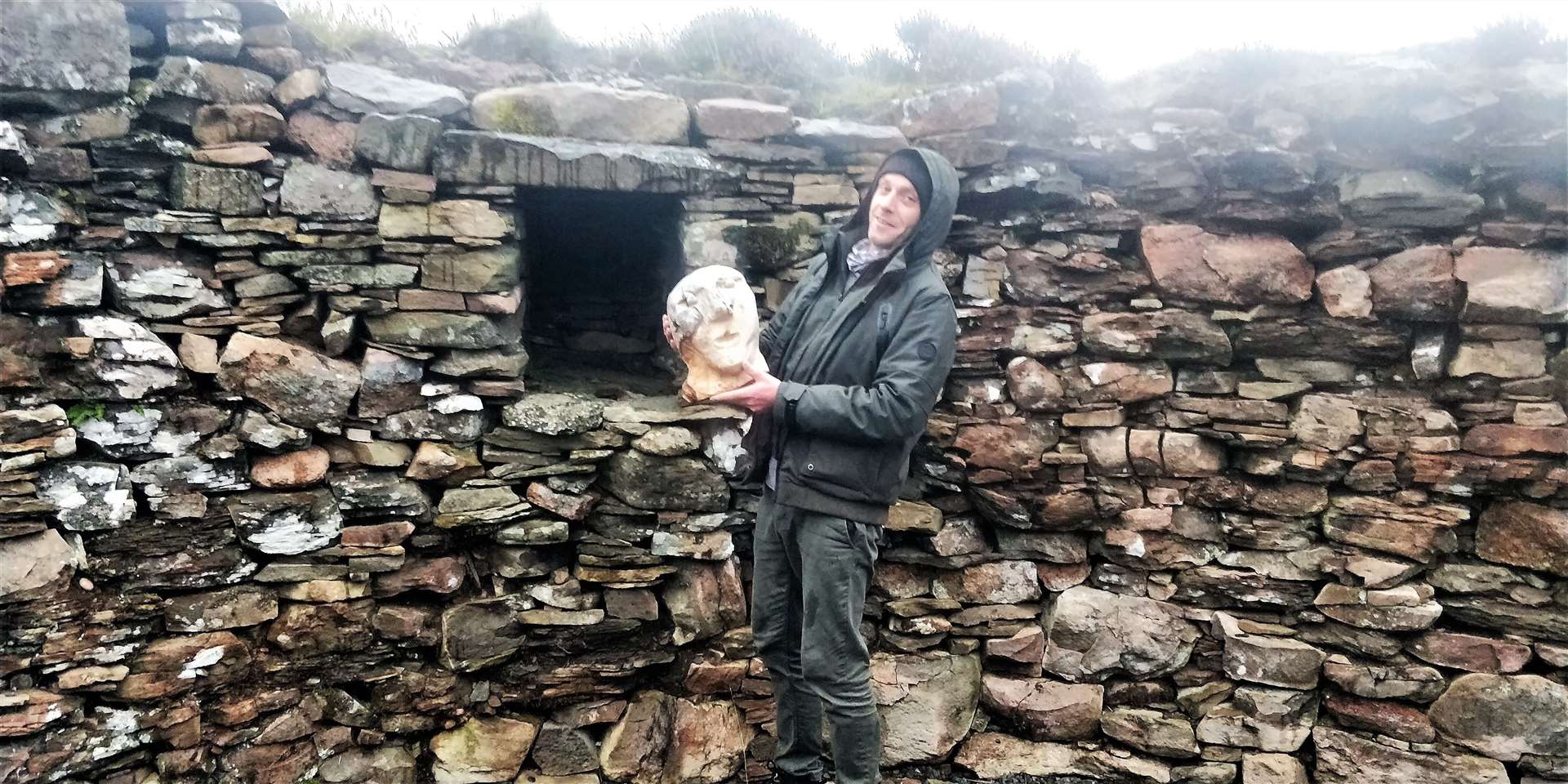 Iain Maclean with the Ousdale Mannie he carved. Pictures: CBP