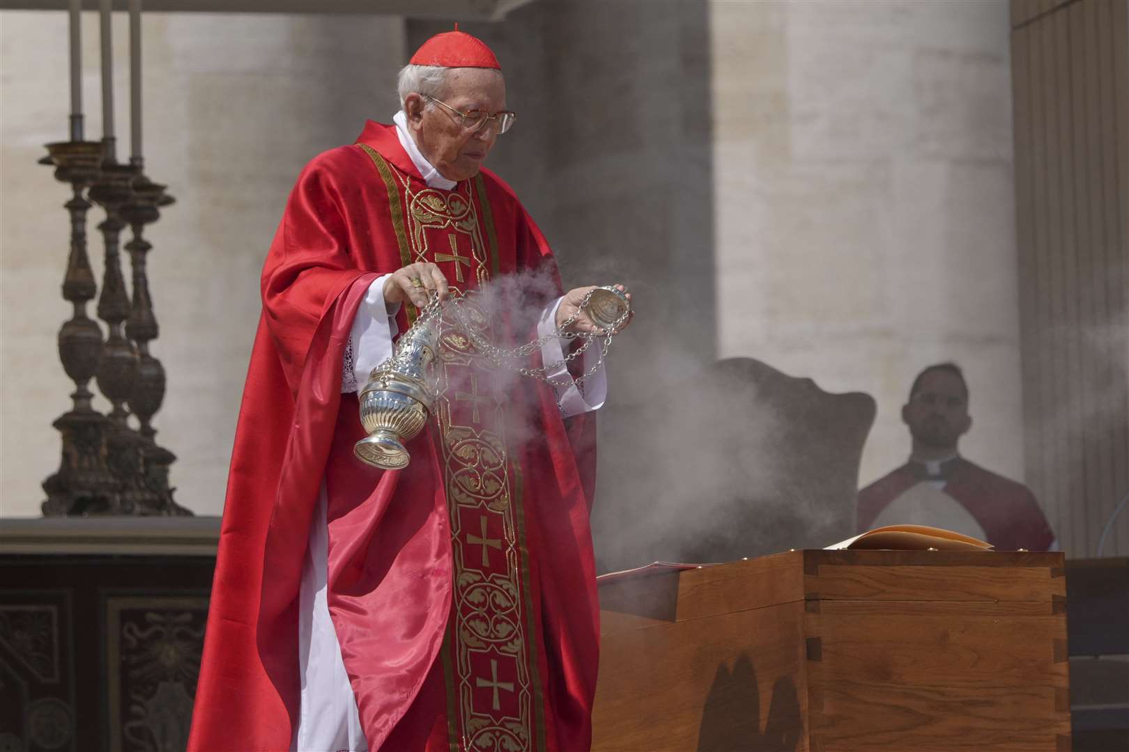 Dean of the College of Cardinals Giovanni Battista Re blesses the coffin (Alessandra Tarantino/AP)